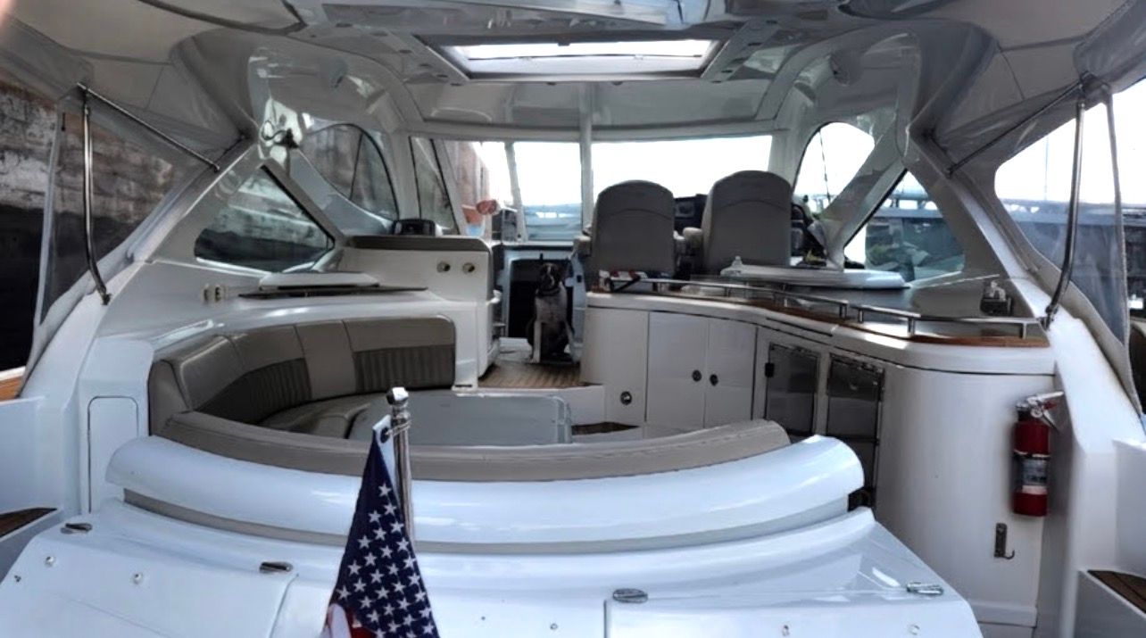 Interior of a 2009 Cruisers Yachts 520 Sports Coupe with seating area and helm station.