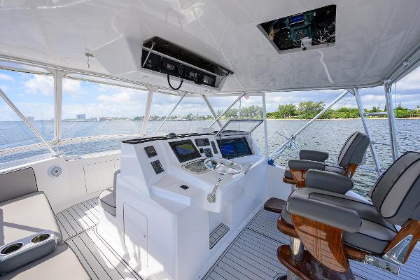 Interior of 2000 Viking 50 Convertible yacht with modern helm and seating.