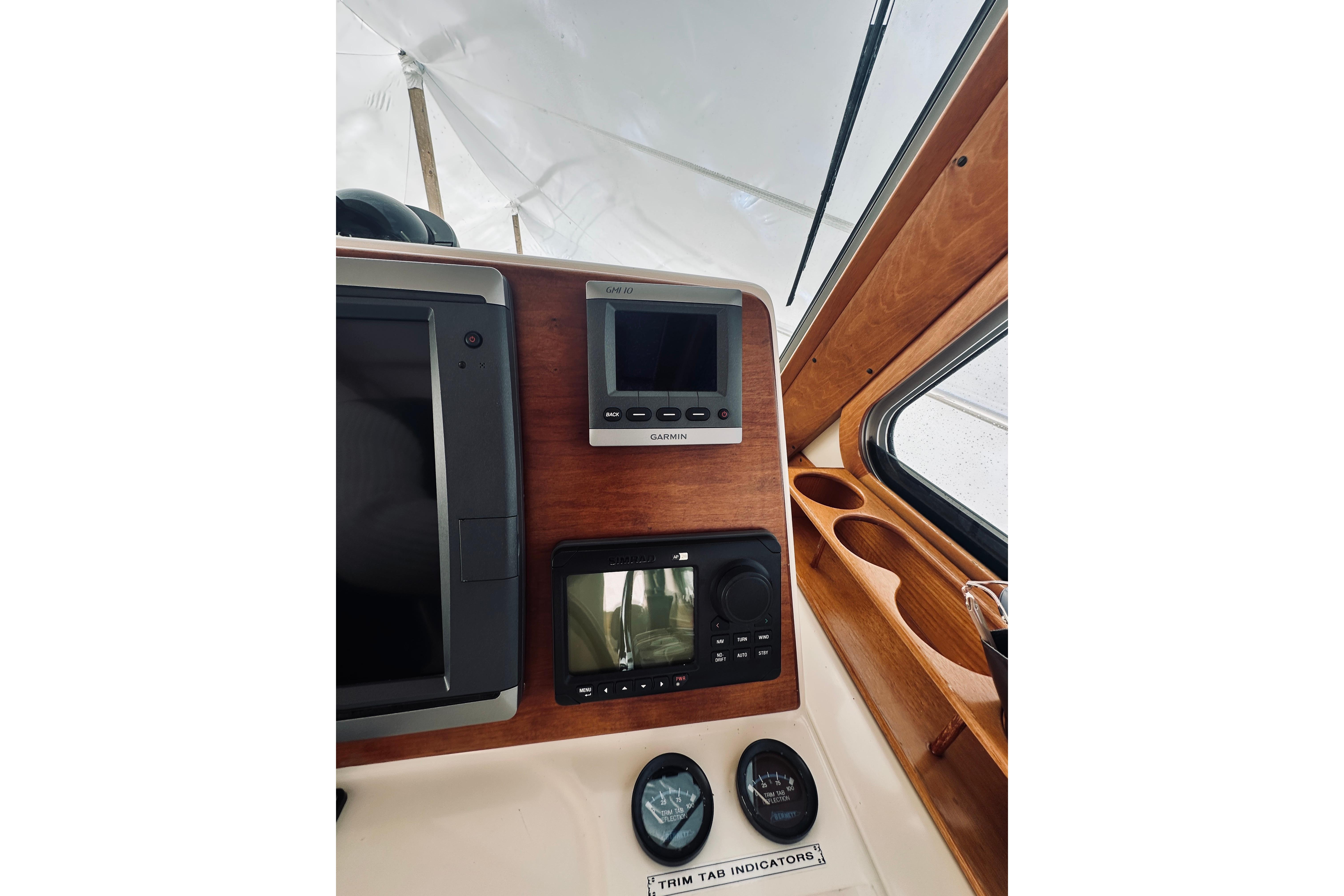 2008 Sabre 38 Hard Top Express dashboard with navigation instruments and trim tab indicators.