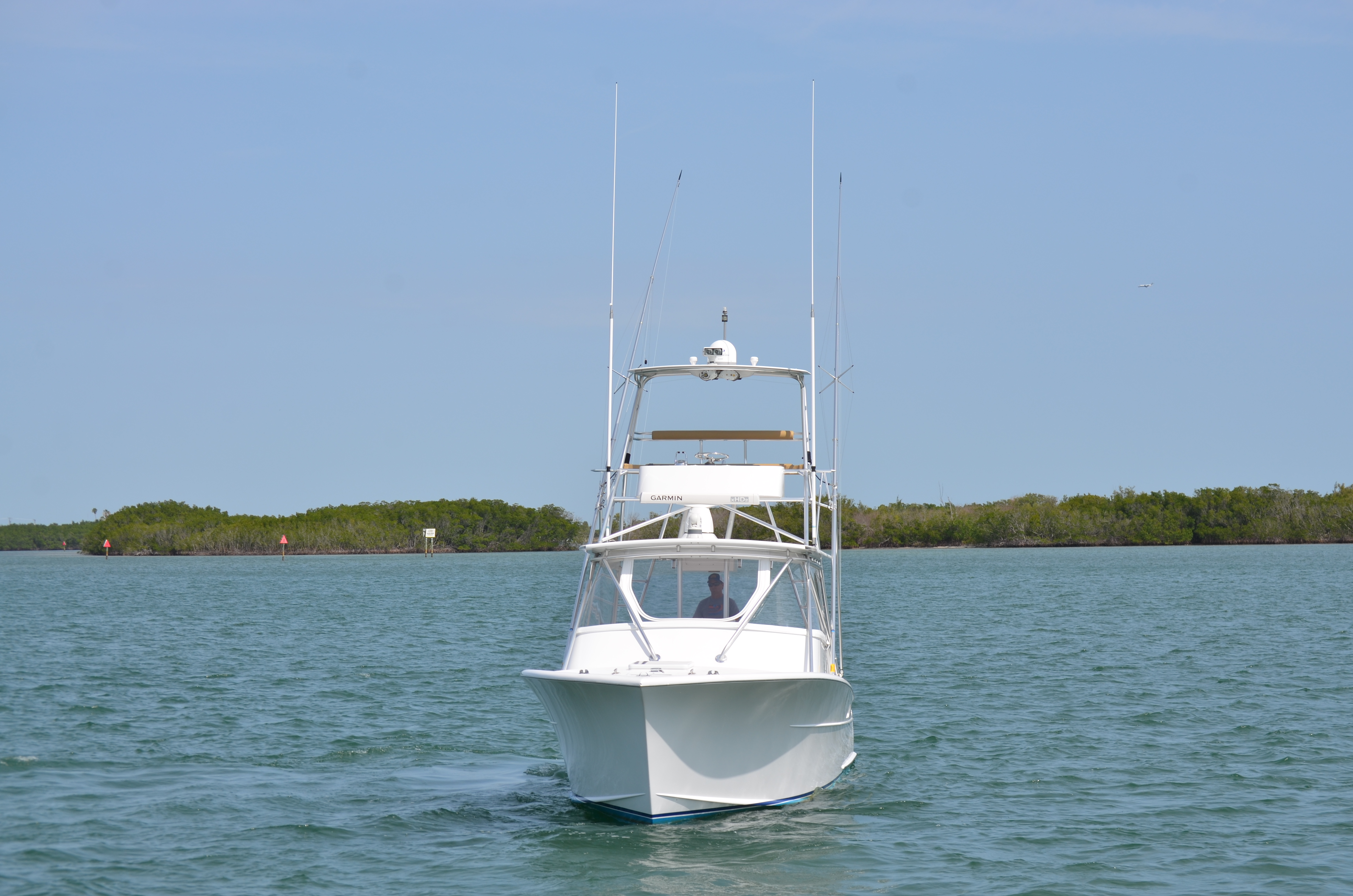 1993 Gamefisherman Open boat on calm water.