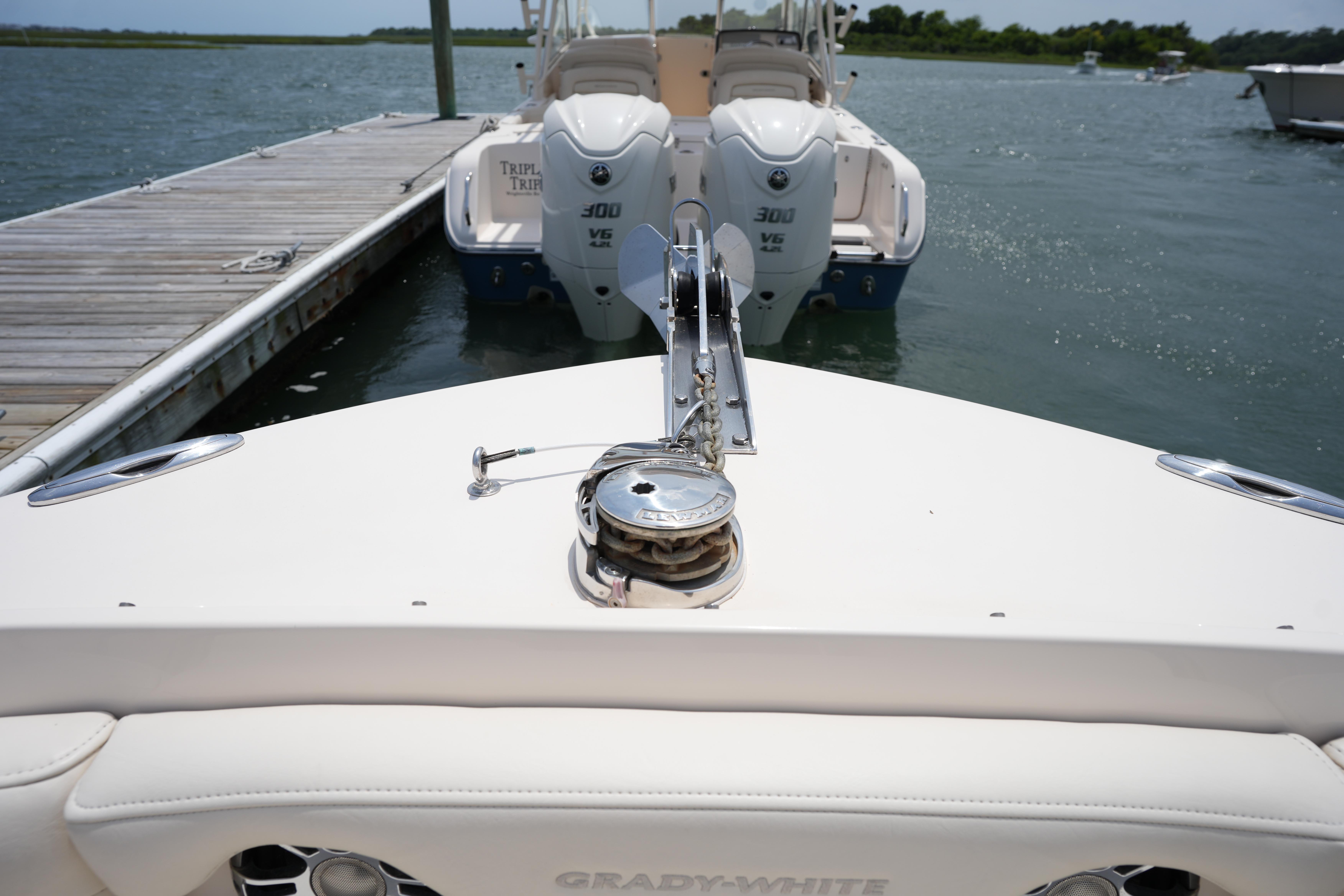 2021 Grady-White Freedom 235 boat docked, featuring dual Yamaha 300 V6 engines.