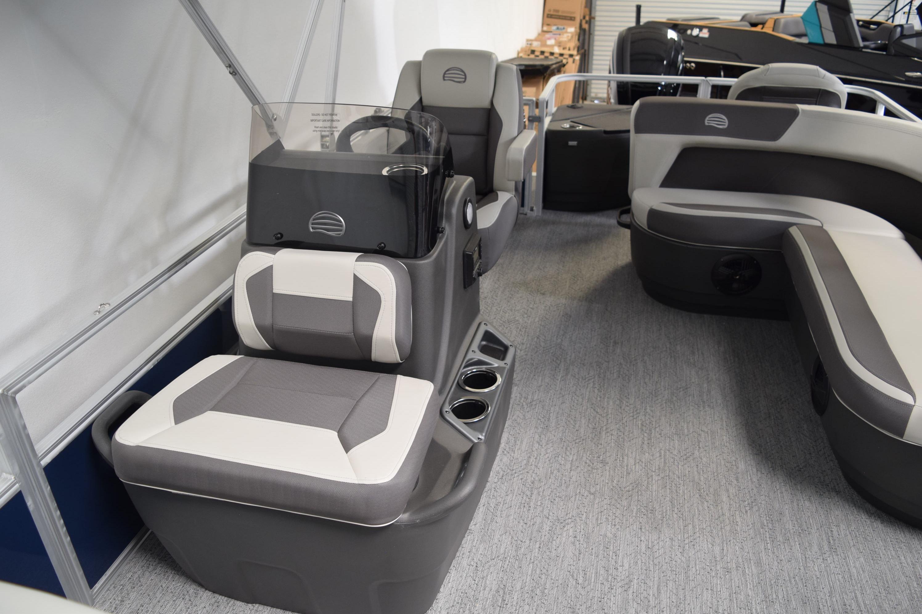 2026 Sun Tracker Bass Buggy 18 DLX interior with gray seating and console.