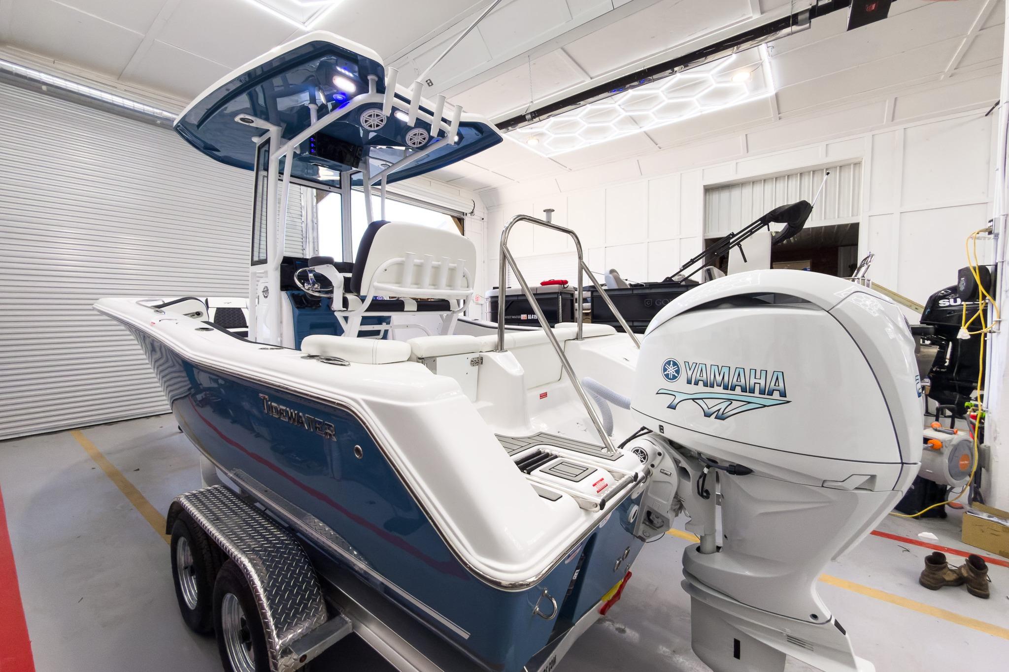 2026 Tidewater 220 LXF on a trailer in a warehouse. Yamaha engine visible.