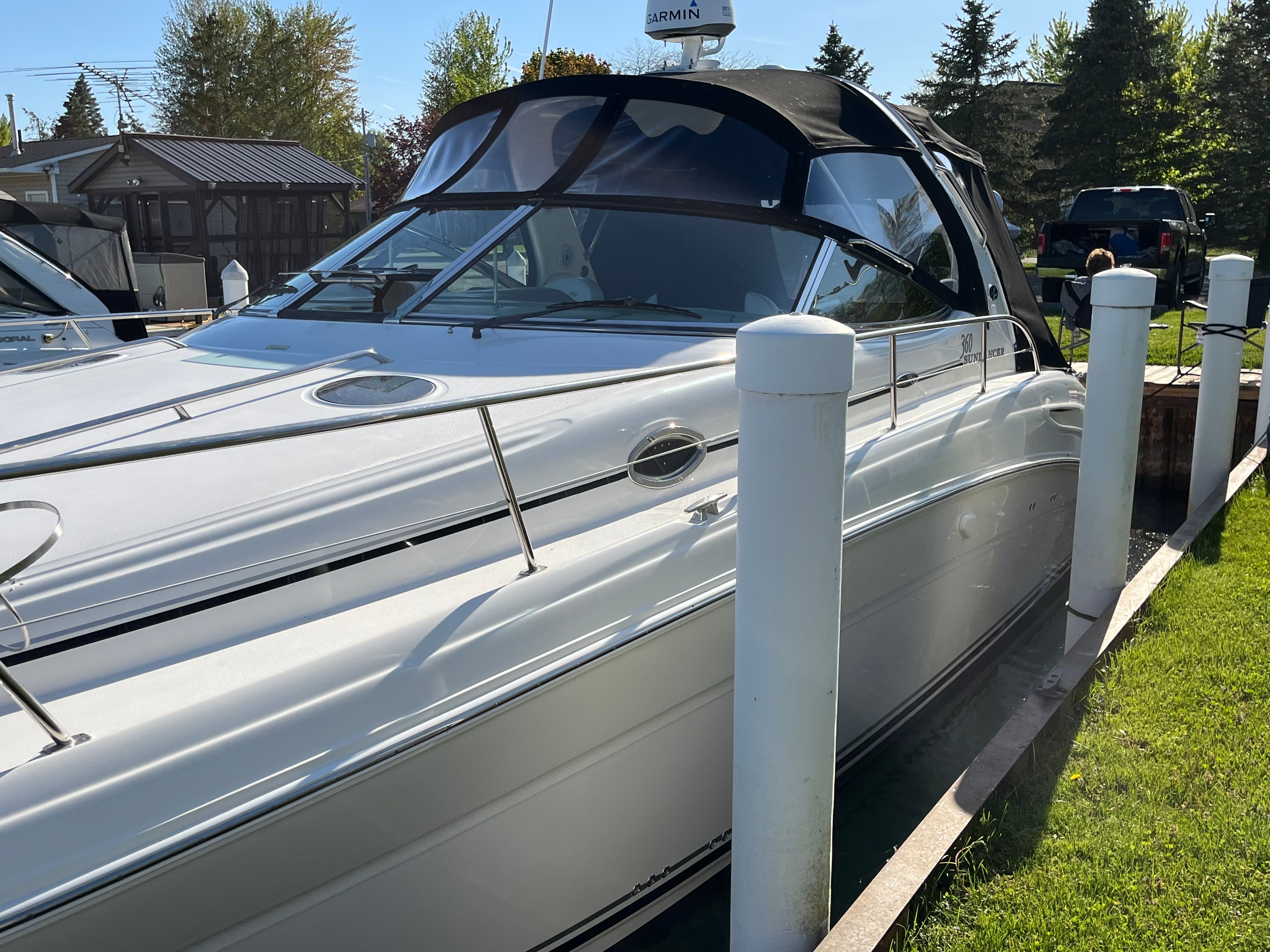2005 Sea Ray Sundancer boat docked at marina.