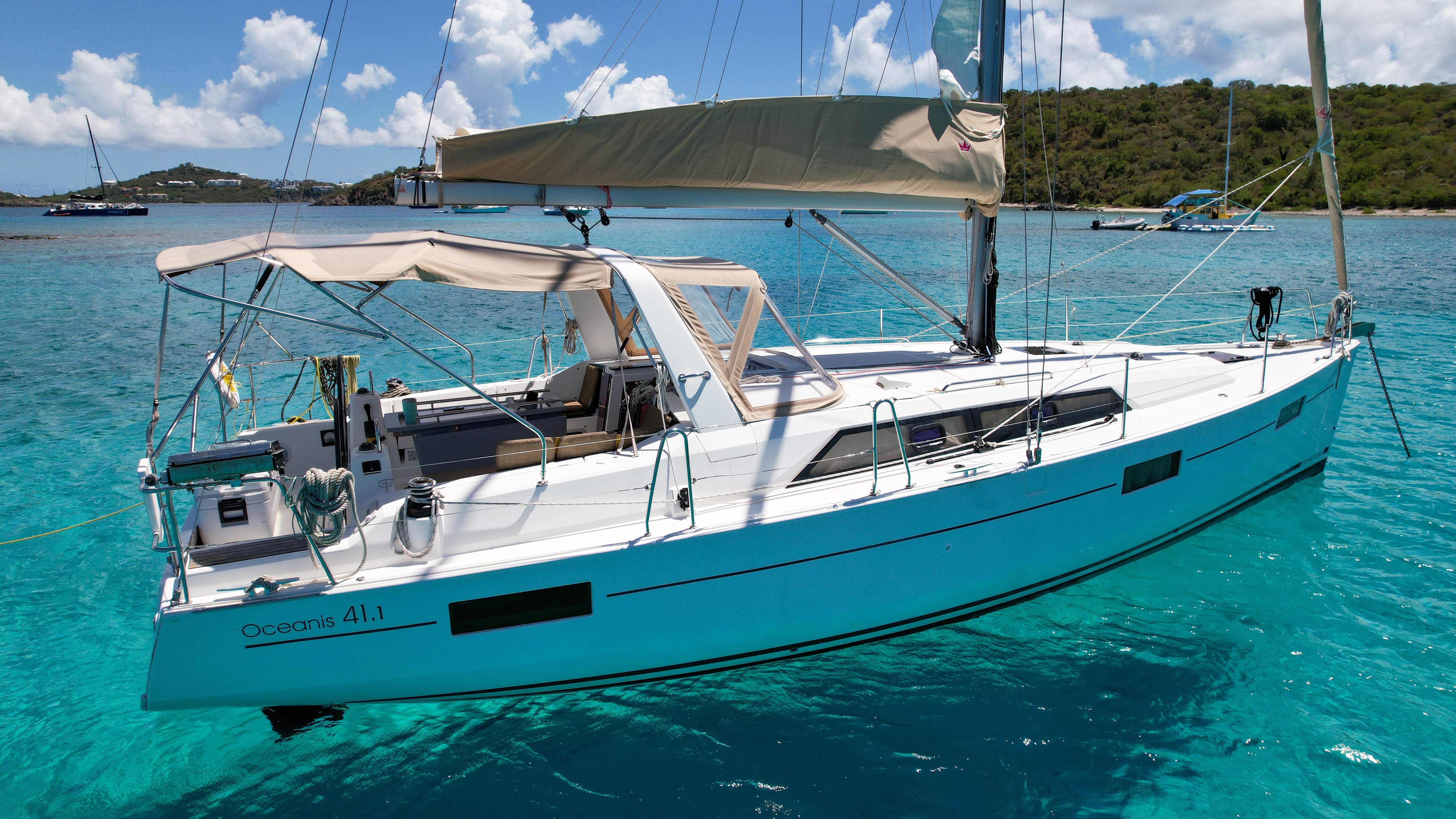 2018 Beneteau Oceanis 41.1 sailboat anchored in clear turquoise waters.