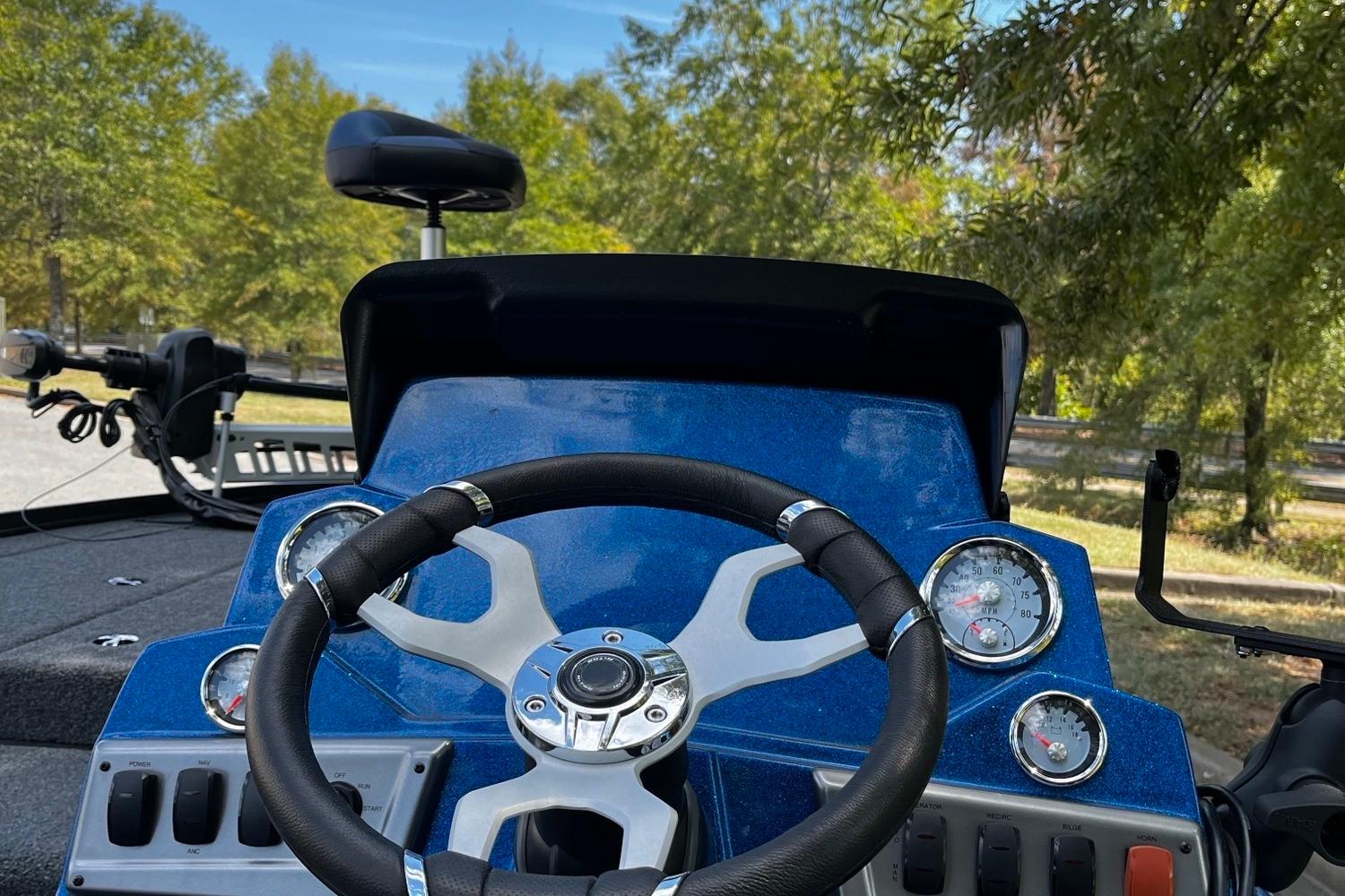 Steering console of a 2025 Nitro Z18 boat with gauges and controls.