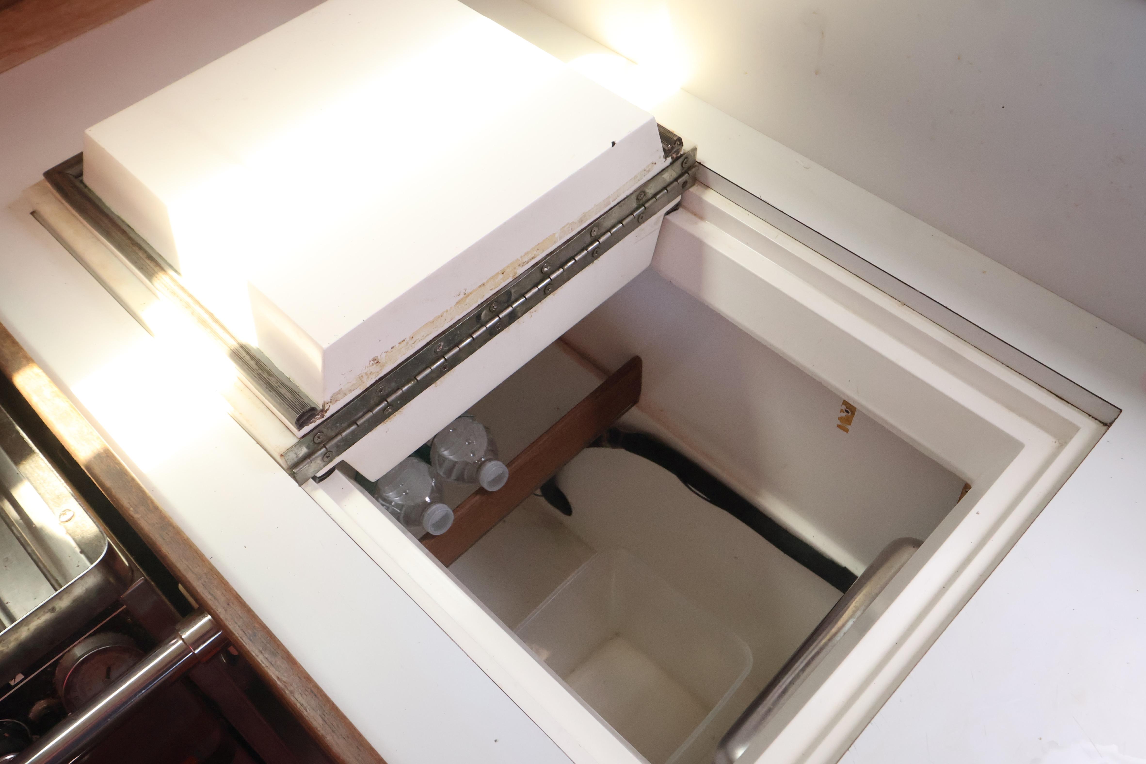 Interior view of a 1989 J Boat J 40, featuring a built-in storage compartment.