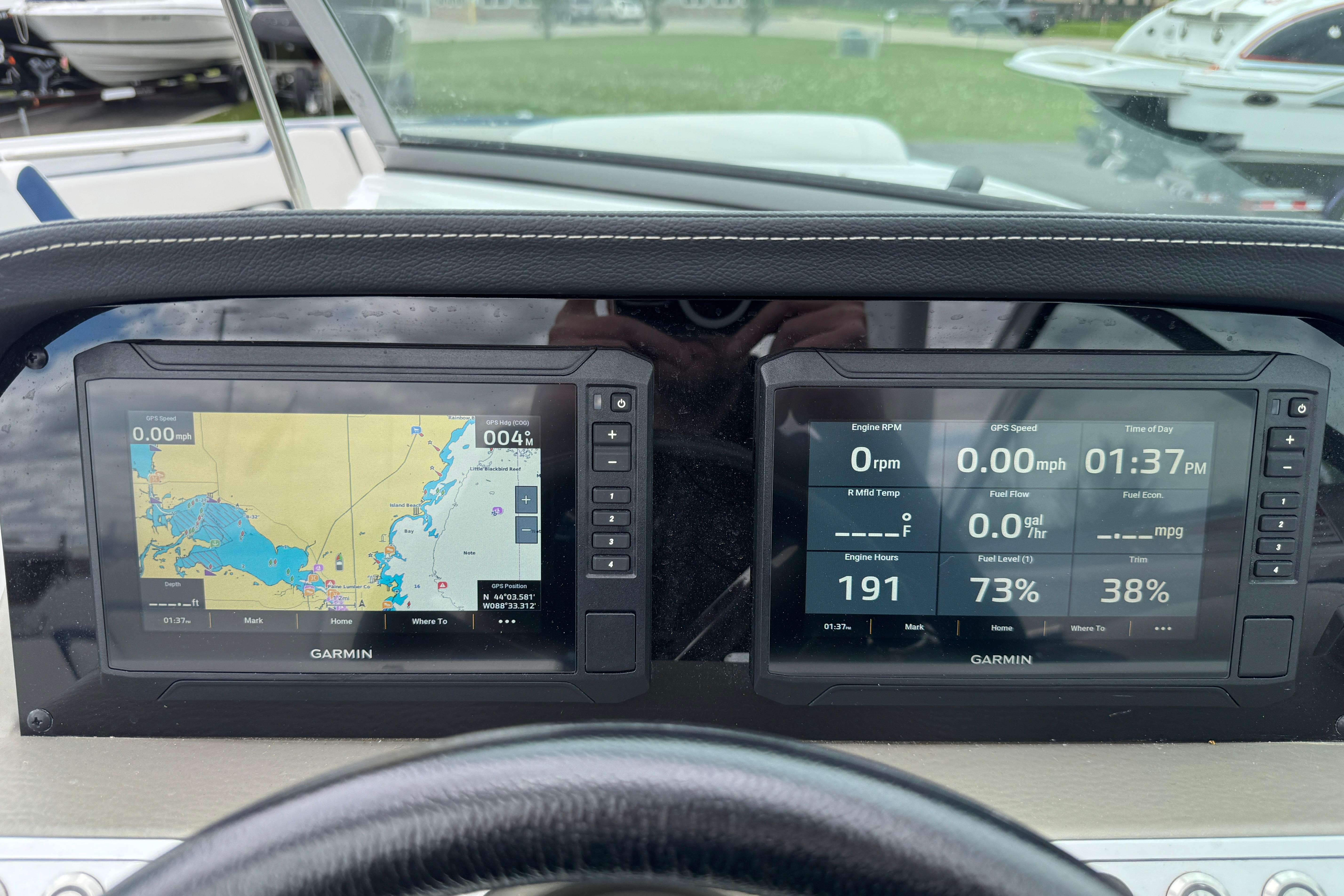 Dashboard of 2025 Crownline 290 XSS boat with Garmin navigation displays.