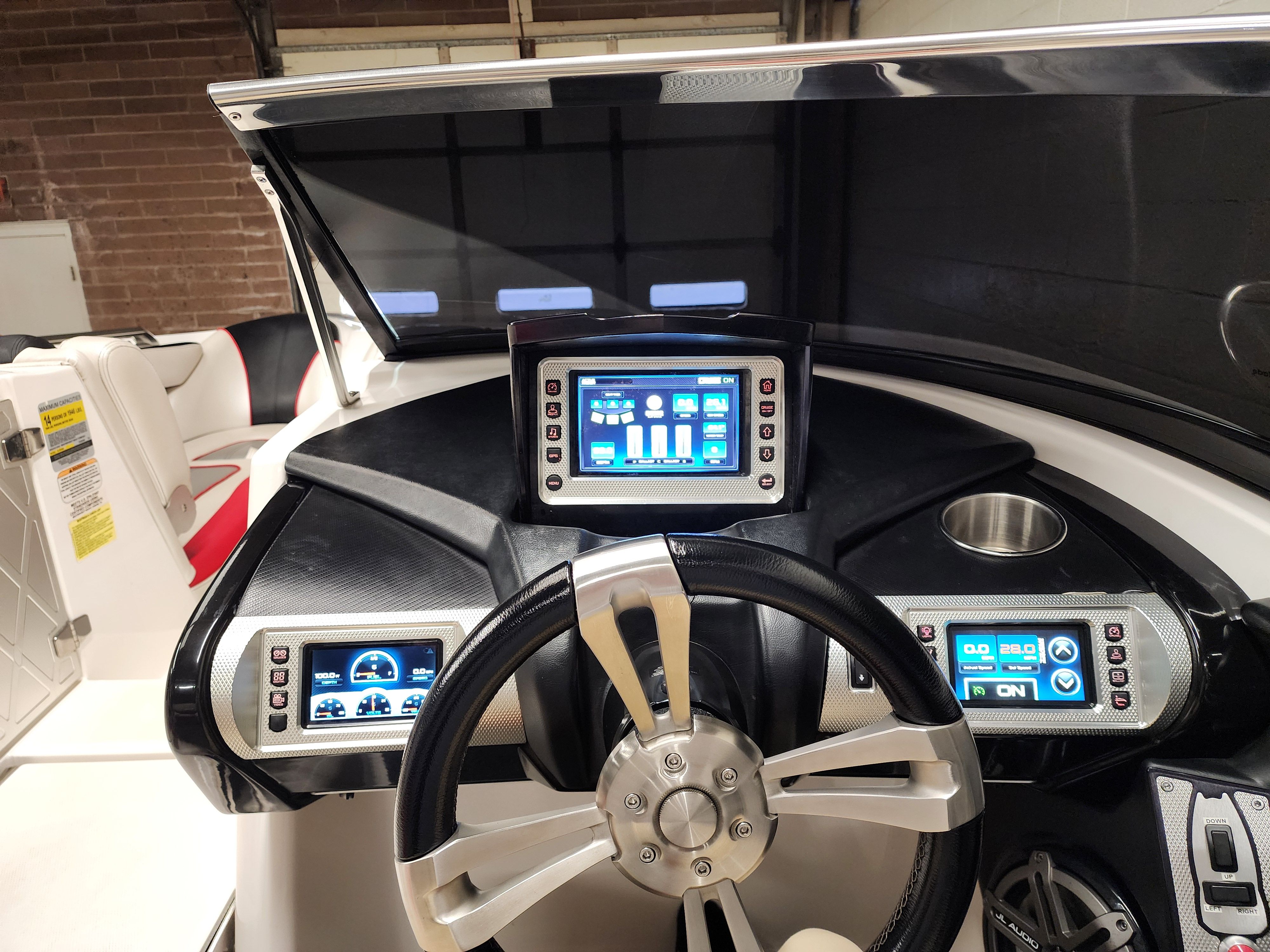 Dashboard of a 2013 MasterCraft XStar boat with modern displays.