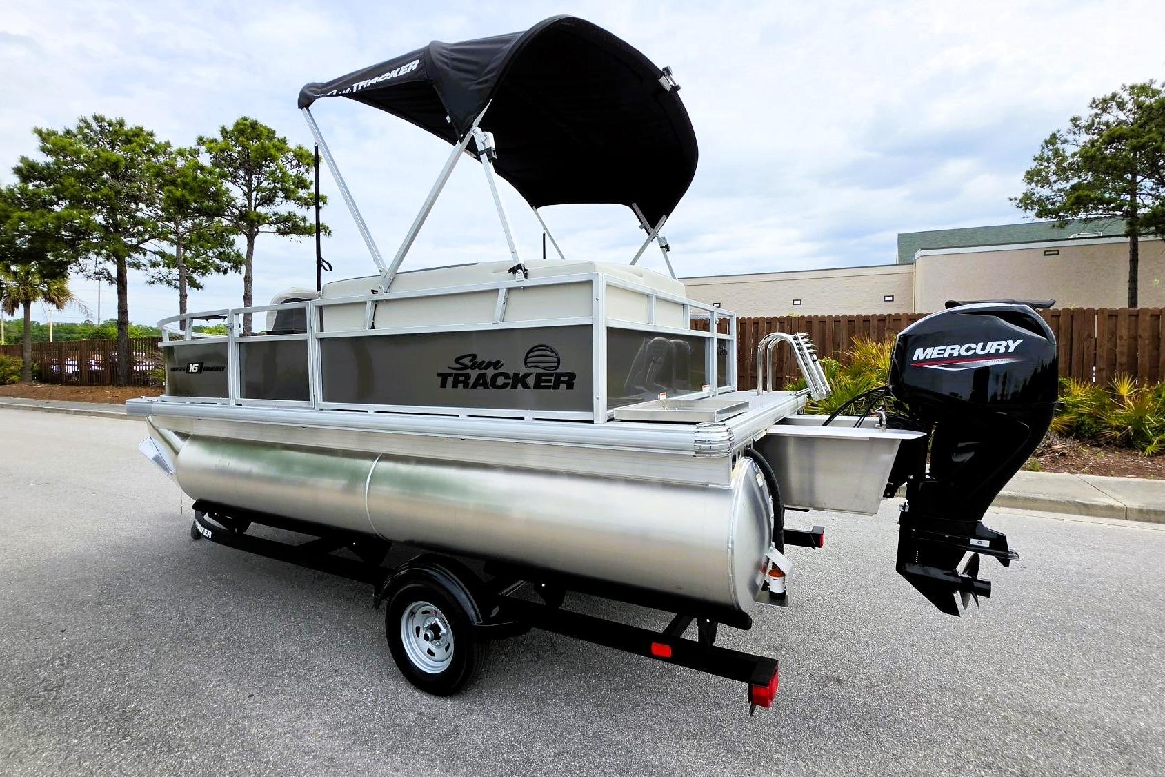 2026 Sun Tracker Bass Buggy 16 XL Select pontoon boat with Mercury outboard motor.