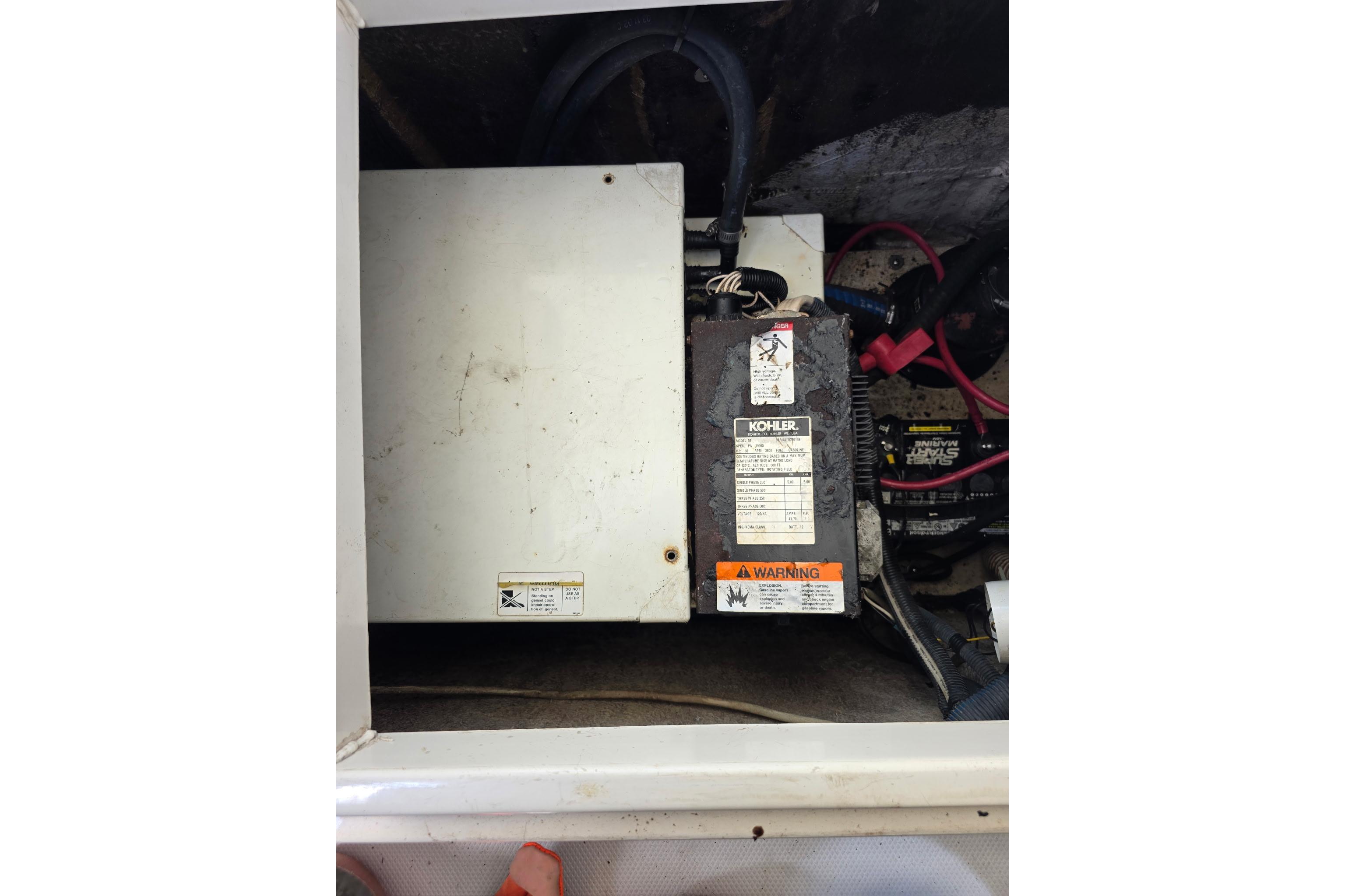 2007 Seaswirl Striper 2901 Walkaround O/B engine compartment with Kohler generator and wiring.
