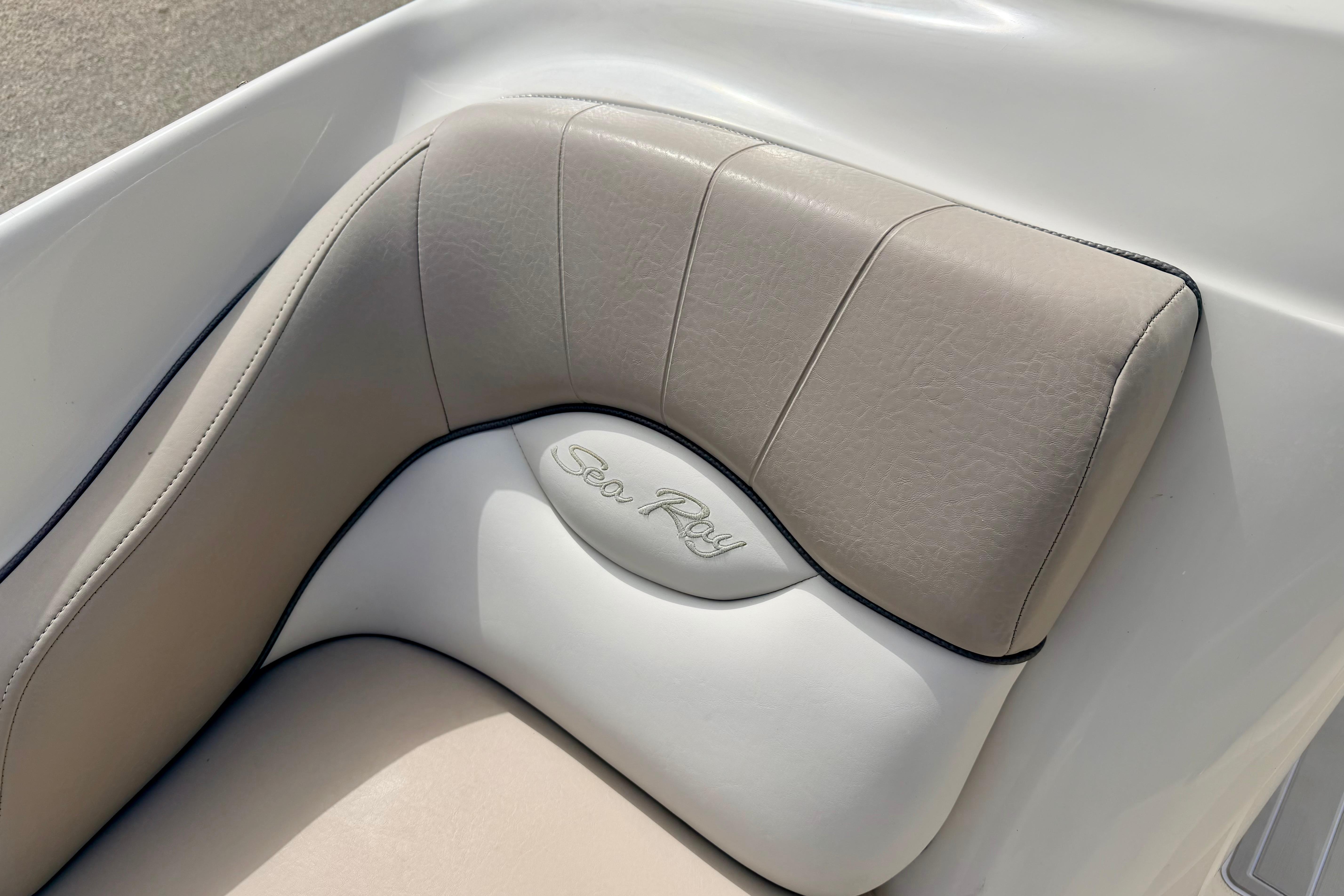 Close-up of 2003 Sea Ray 200 Sundeck boat seat with logo.