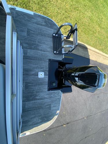 2024 Ranger Reata 223C boat with motor, viewed from above on a sunny day.
