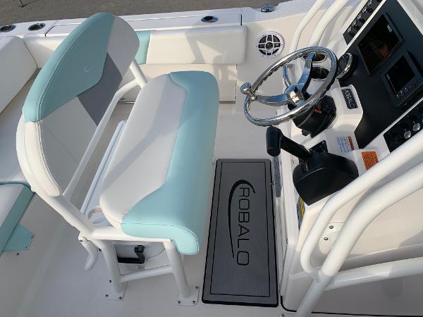 2024 Robalo R202 Explorer boat interior with steering wheel and seating.