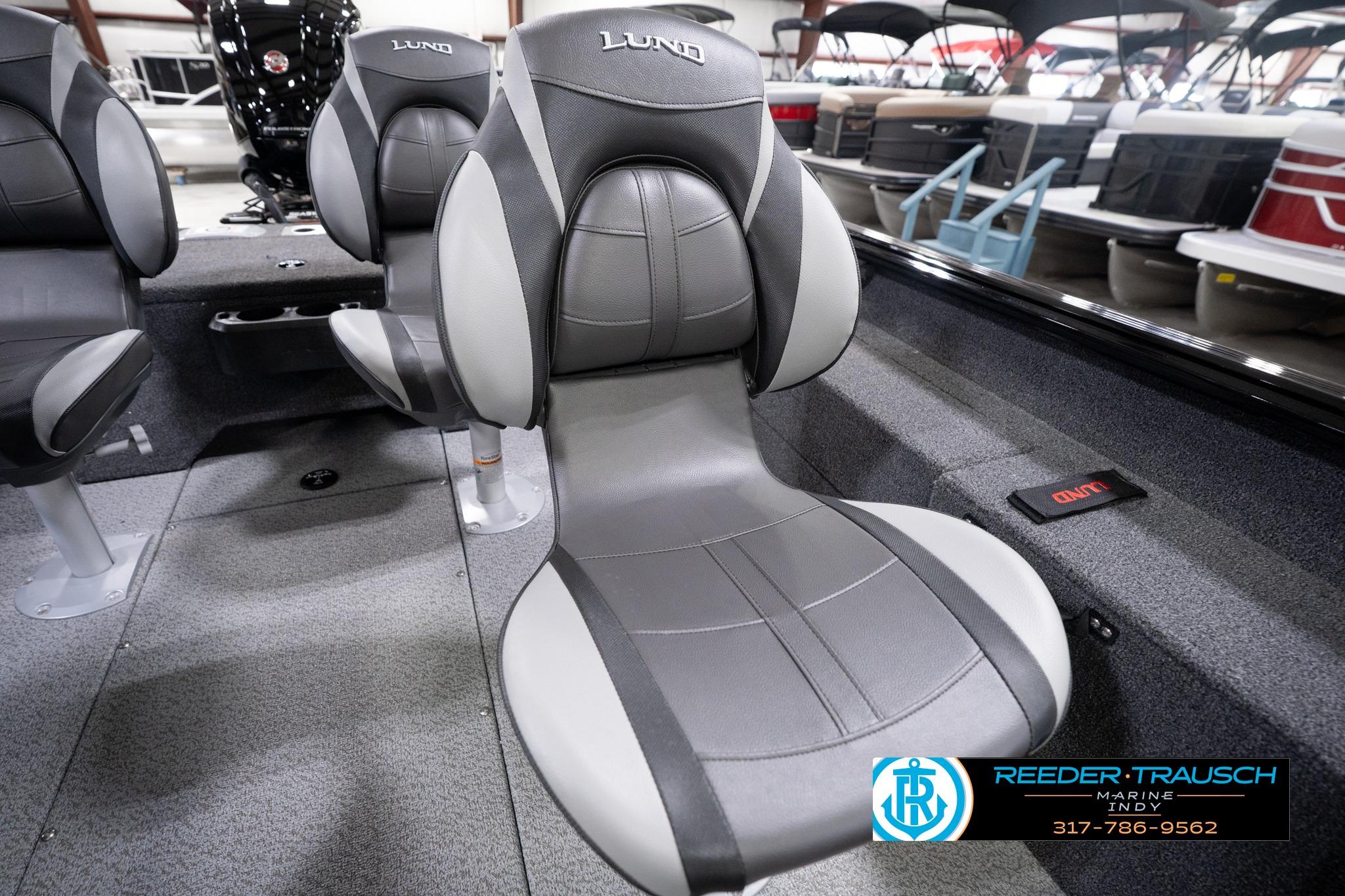 2026 Lund 1775 Impact XS SS boat interior with gray seating and marine dealership logo.