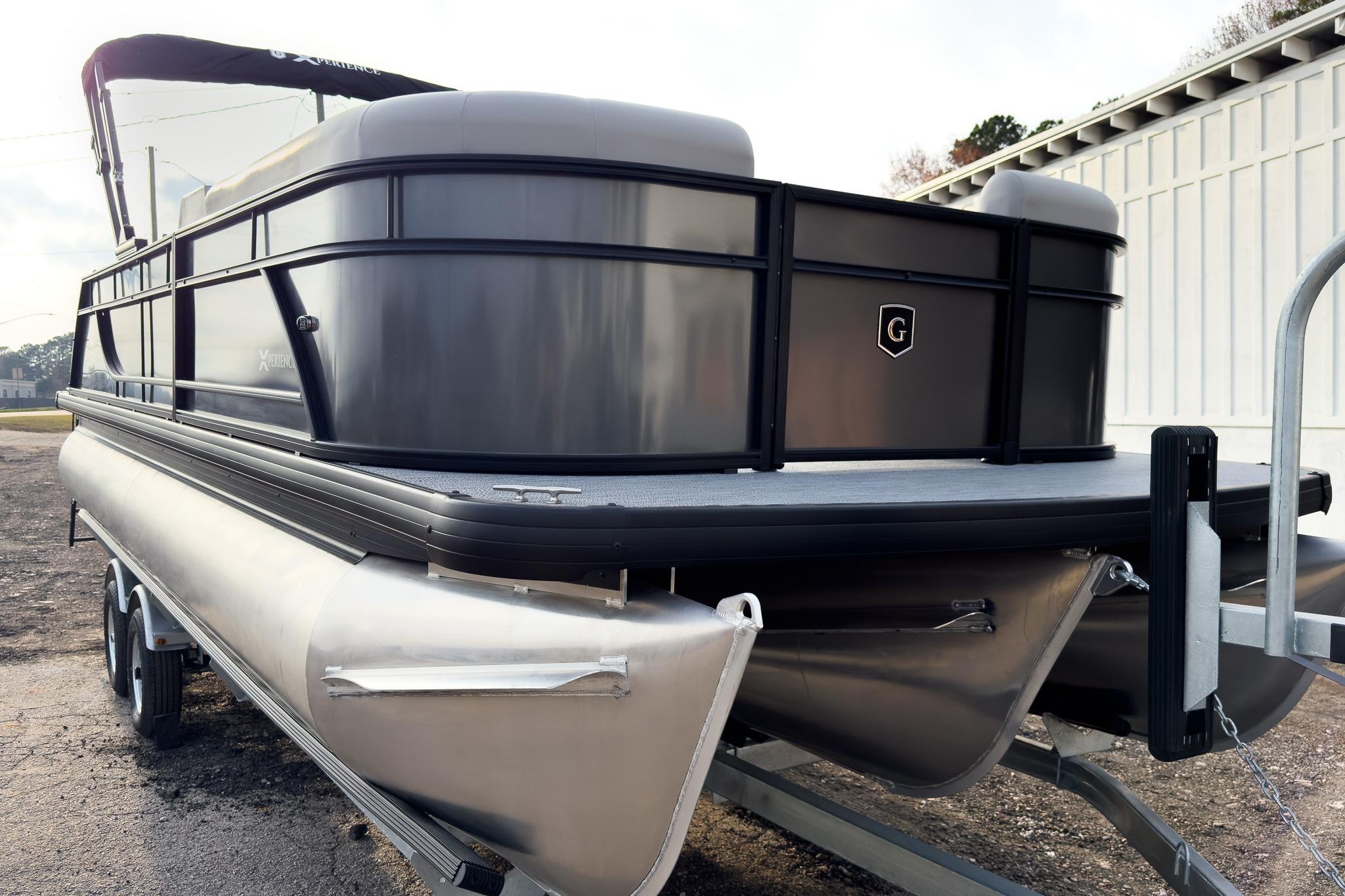 2026 Godfrey Sweetwater Xperience 22' Tritoon boat on trailer, side view.