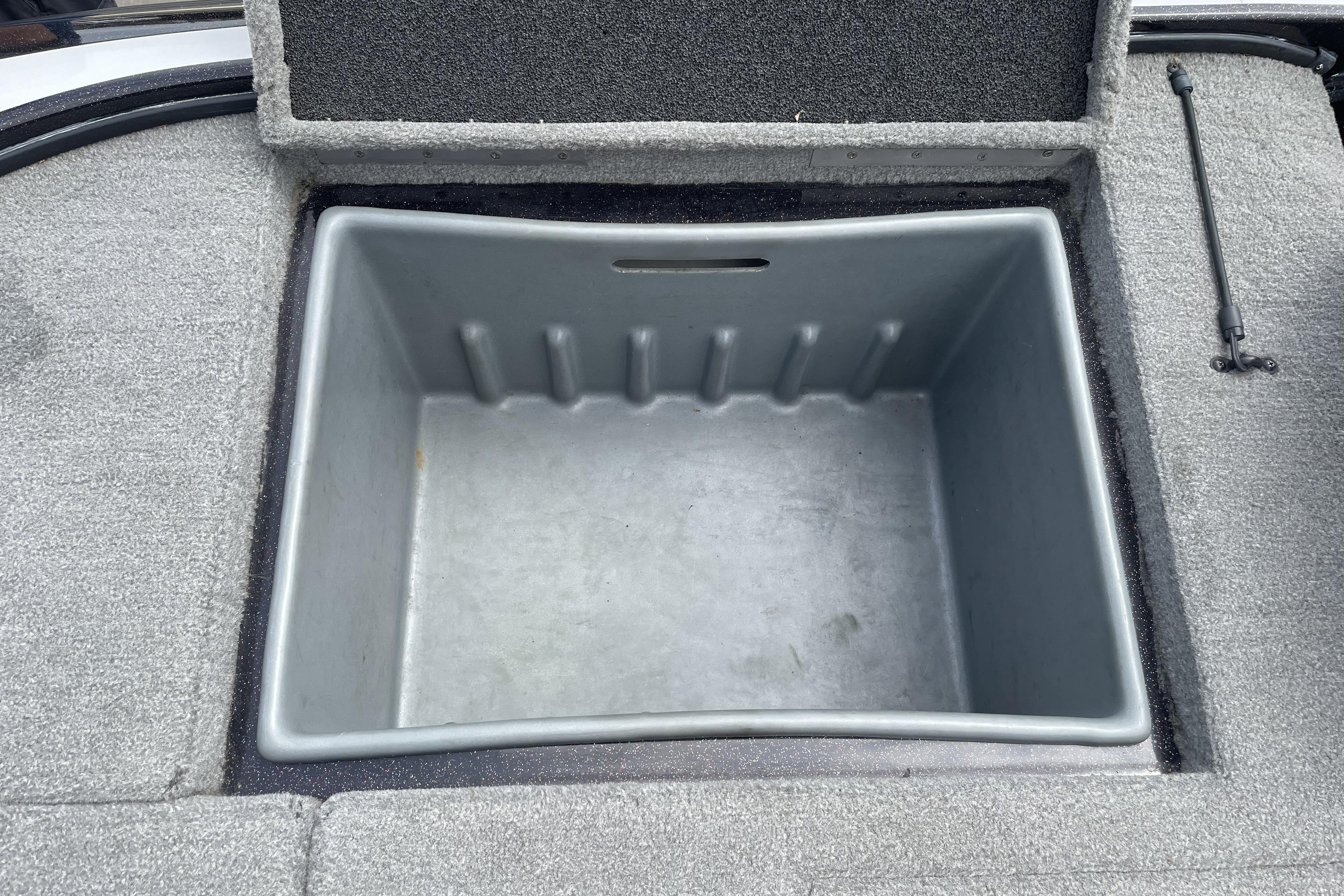 Open storage compartment in 2013 Nitro Z-8 boat, featuring a spacious interior.