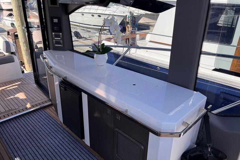 2024 Galeon 425 HTS yacht interior with sleek countertop and potted orchid.
