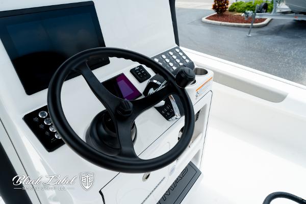 Steering console of 2025 Caymas 281 HB boat with modern controls and displays.