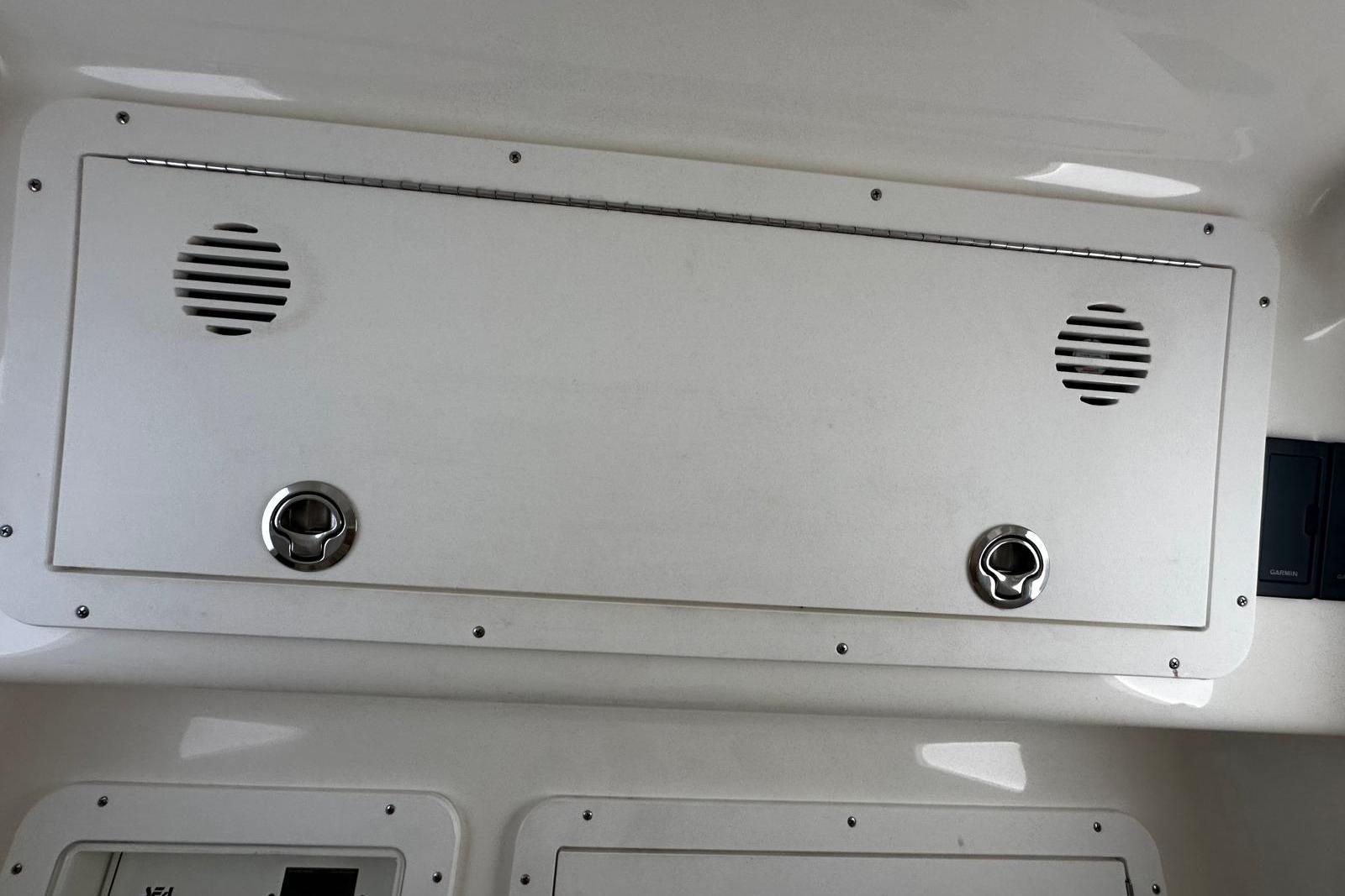 2022 SeaVee 390Z boat interior panel with speakers and latches.