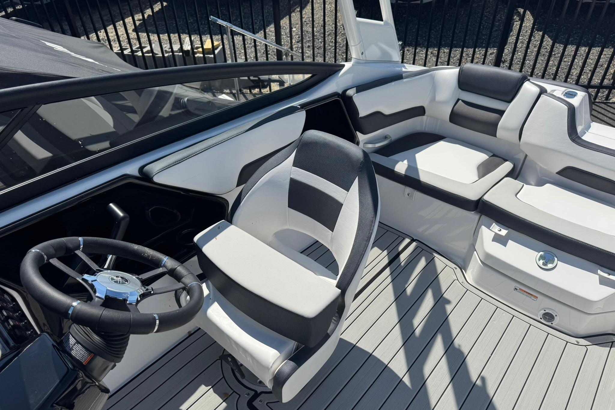 2026 Yamaha Boats 195S interior with sleek seating and modern steering wheel design.