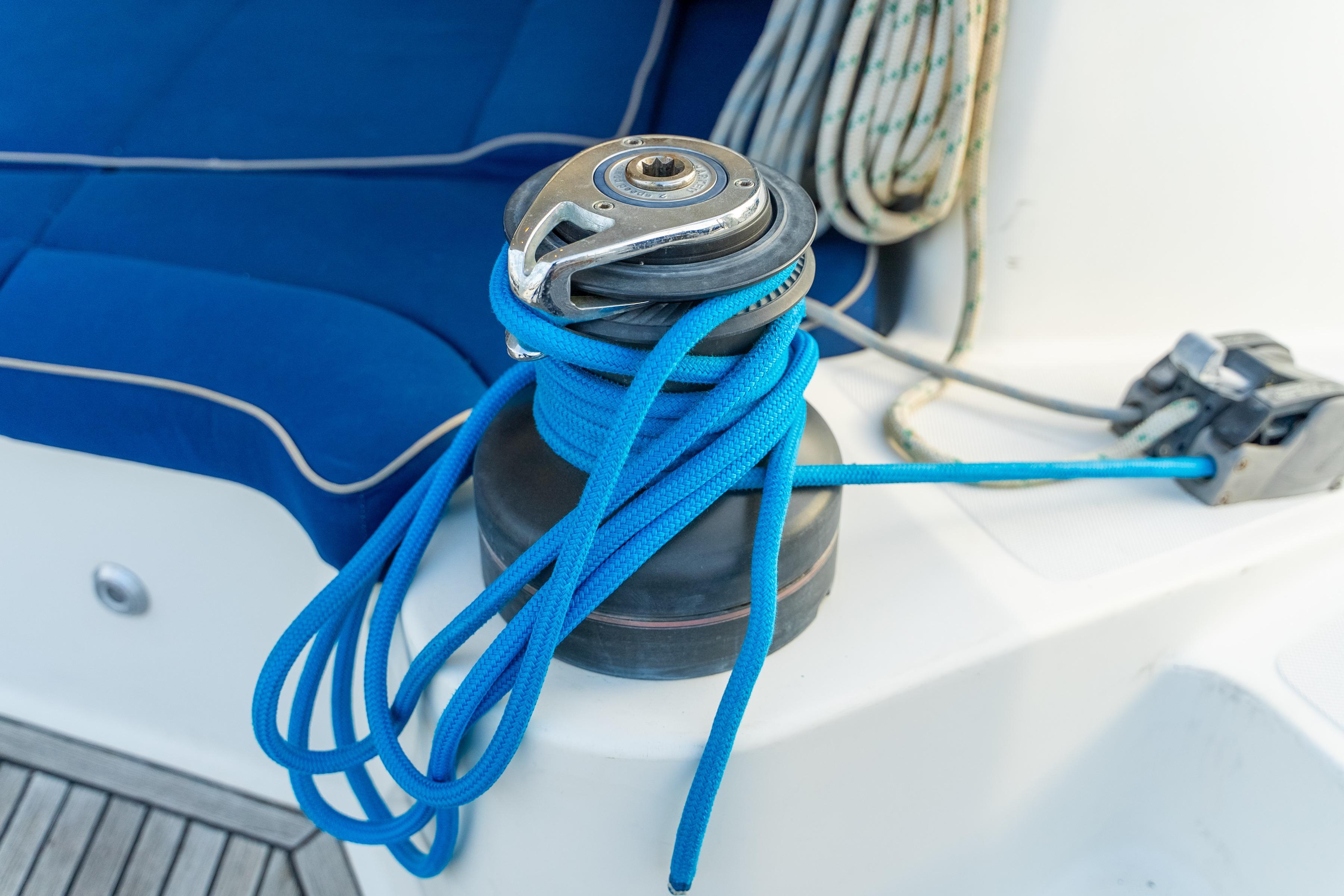 Winch with blue rope on 2009 Catana 65 yacht deck.