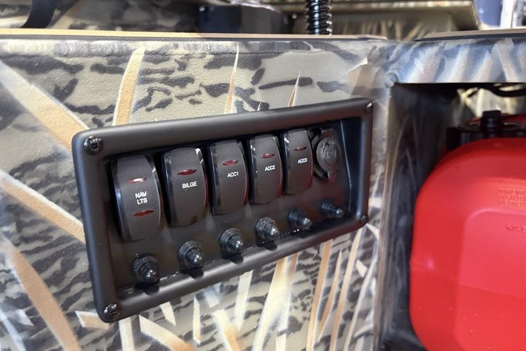 Control panel of 2026 Tracker Grizzly 1650 T Prairie Wings Edition with camo design.