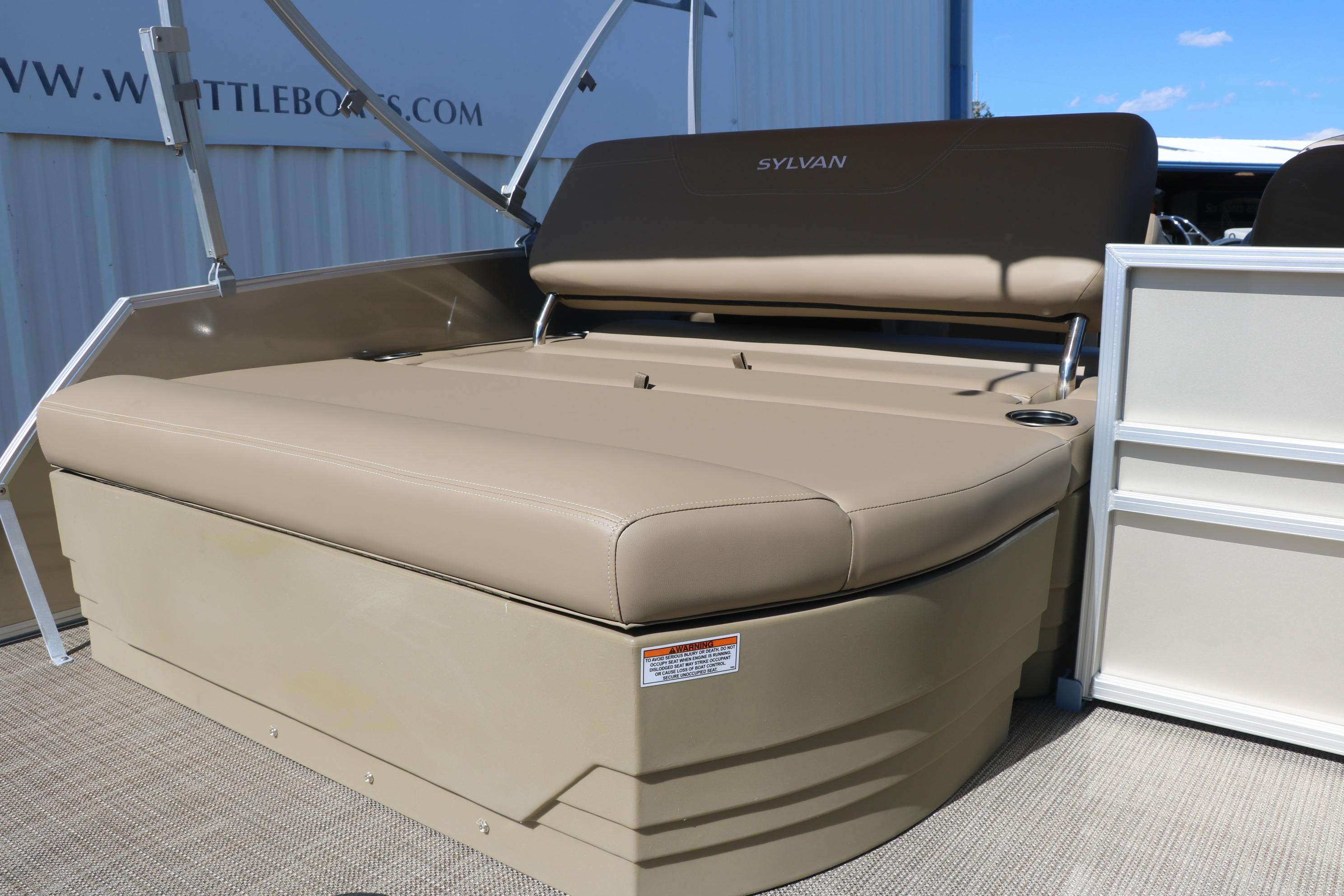2025 Sylvan Mirage 820 CLZ DH boat seating area with beige upholstery.