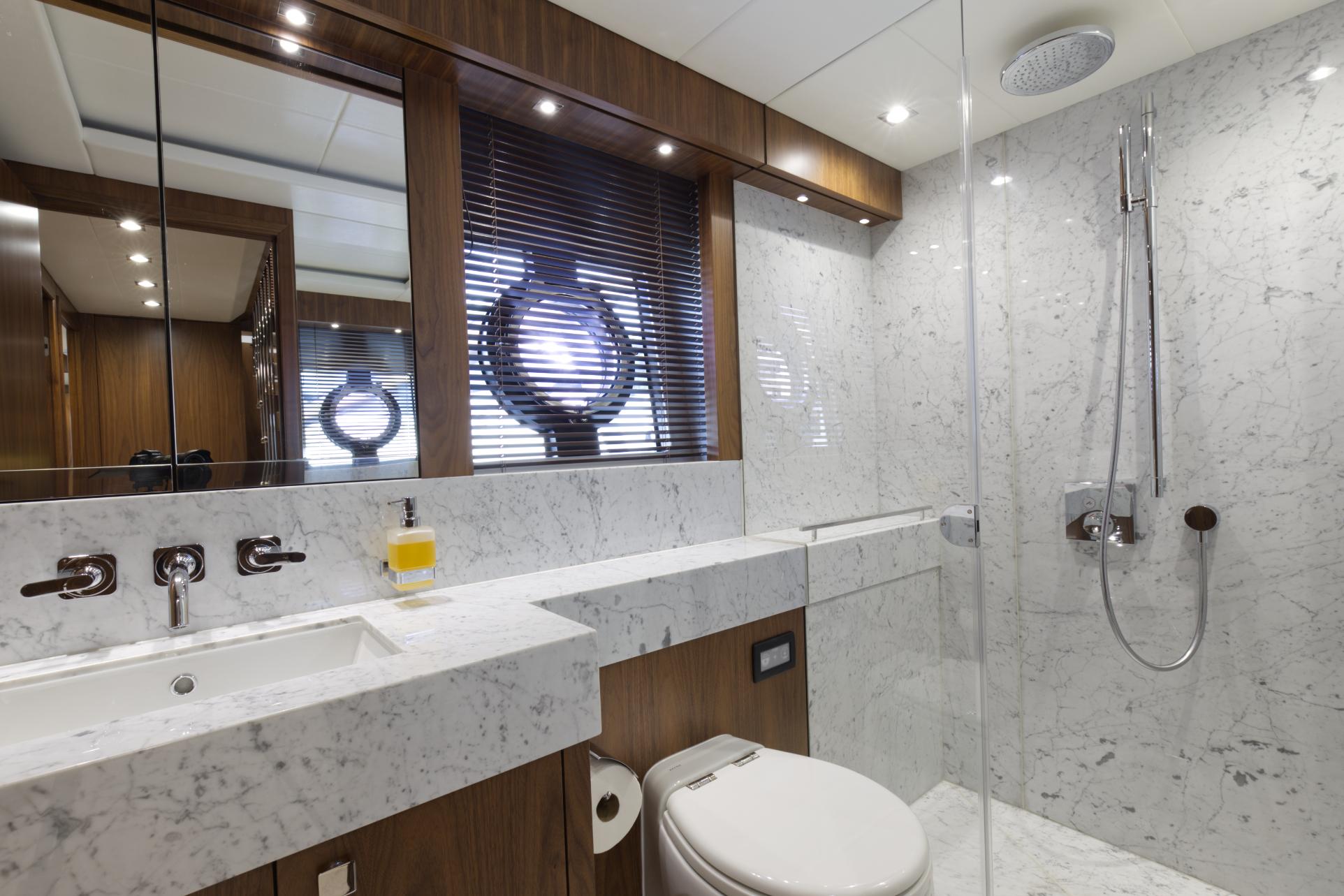 Luxurious bathroom in 2018 Sunseeker 86 Yacht with marble finishes and modern fixtures.