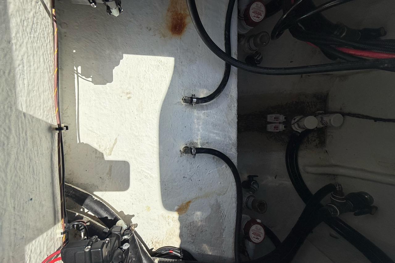 Interior view of 2021 Custom Infusion 34 CC boat showing wiring and components.