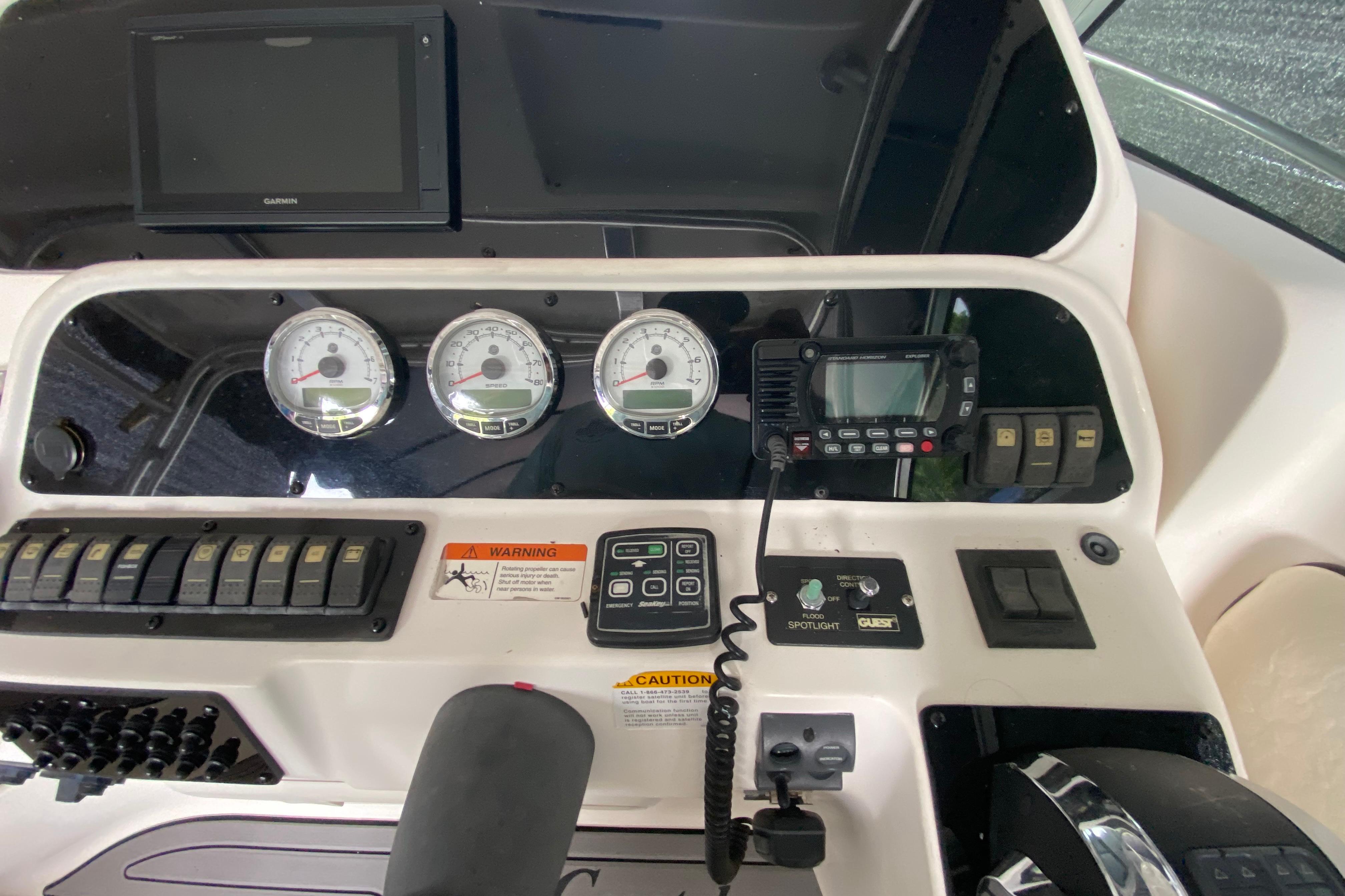 Dashboard of a 2005 Wellcraft 290 Coastal boat with gauges and controls.