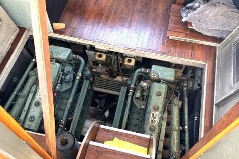 Engine room of a 1980 Viking 43 Convertible boat, showcasing dual engines.
