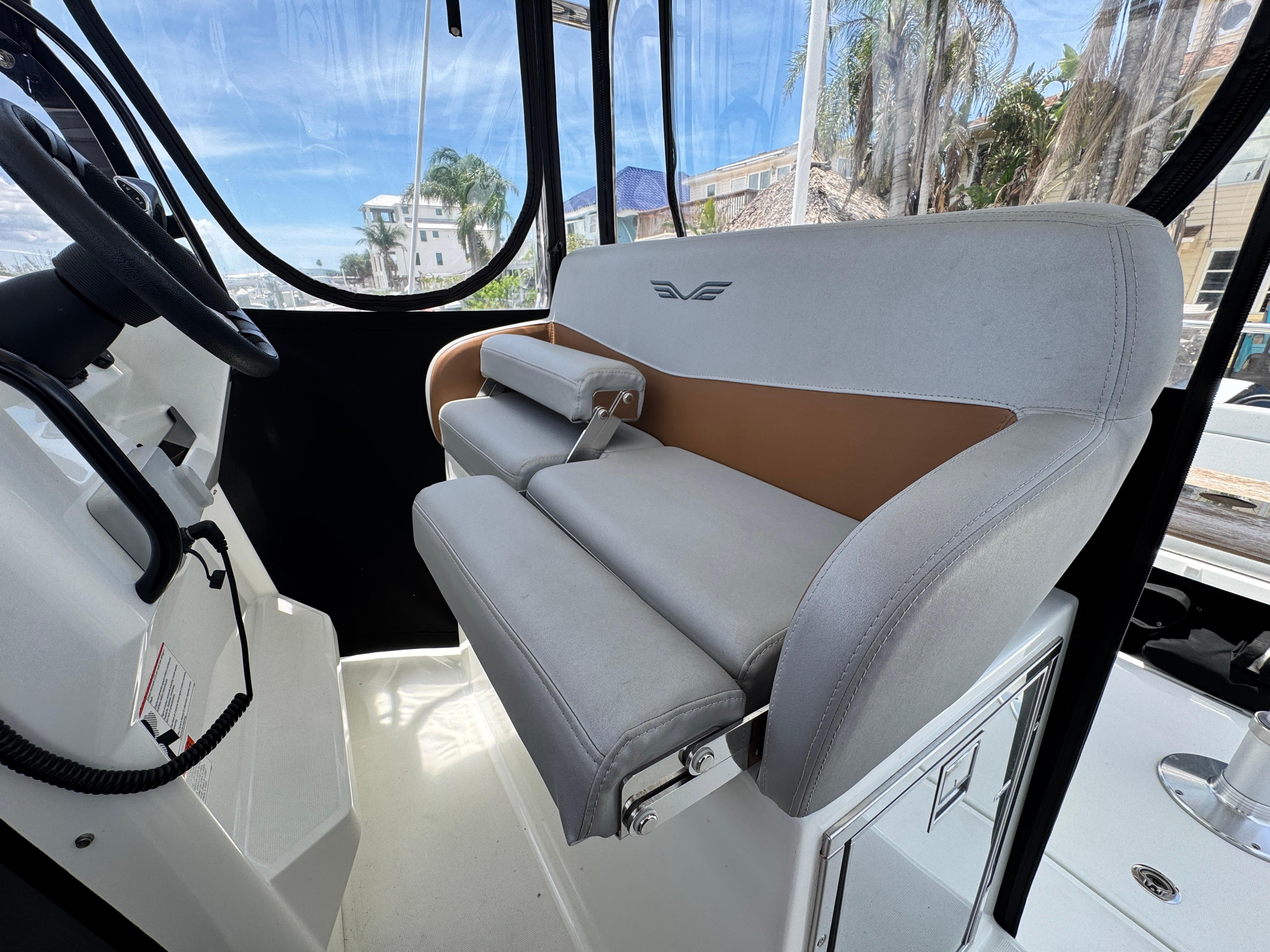 2022 Beneteau Flyer 9 SUNdeck interior with modern seating and steering wheel.
