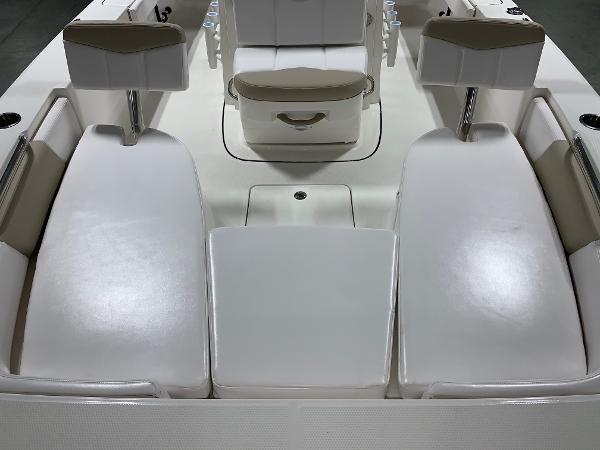 2026 Robalo 226 Cayman boat interior with white seating and storage compartments.