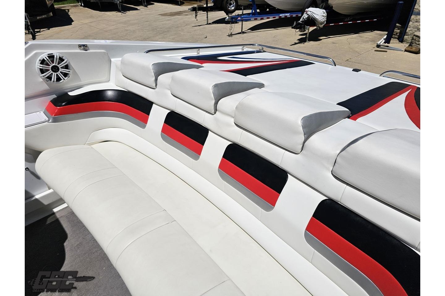 2005 Formula 271 FASTech boat interior with stylish red, black, and white seating design.