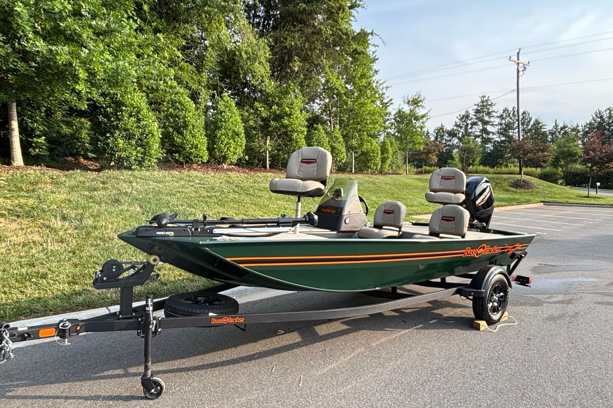 2026 Tracker Bass Tracker Classic Limited boat on trailer, parked outdoors.