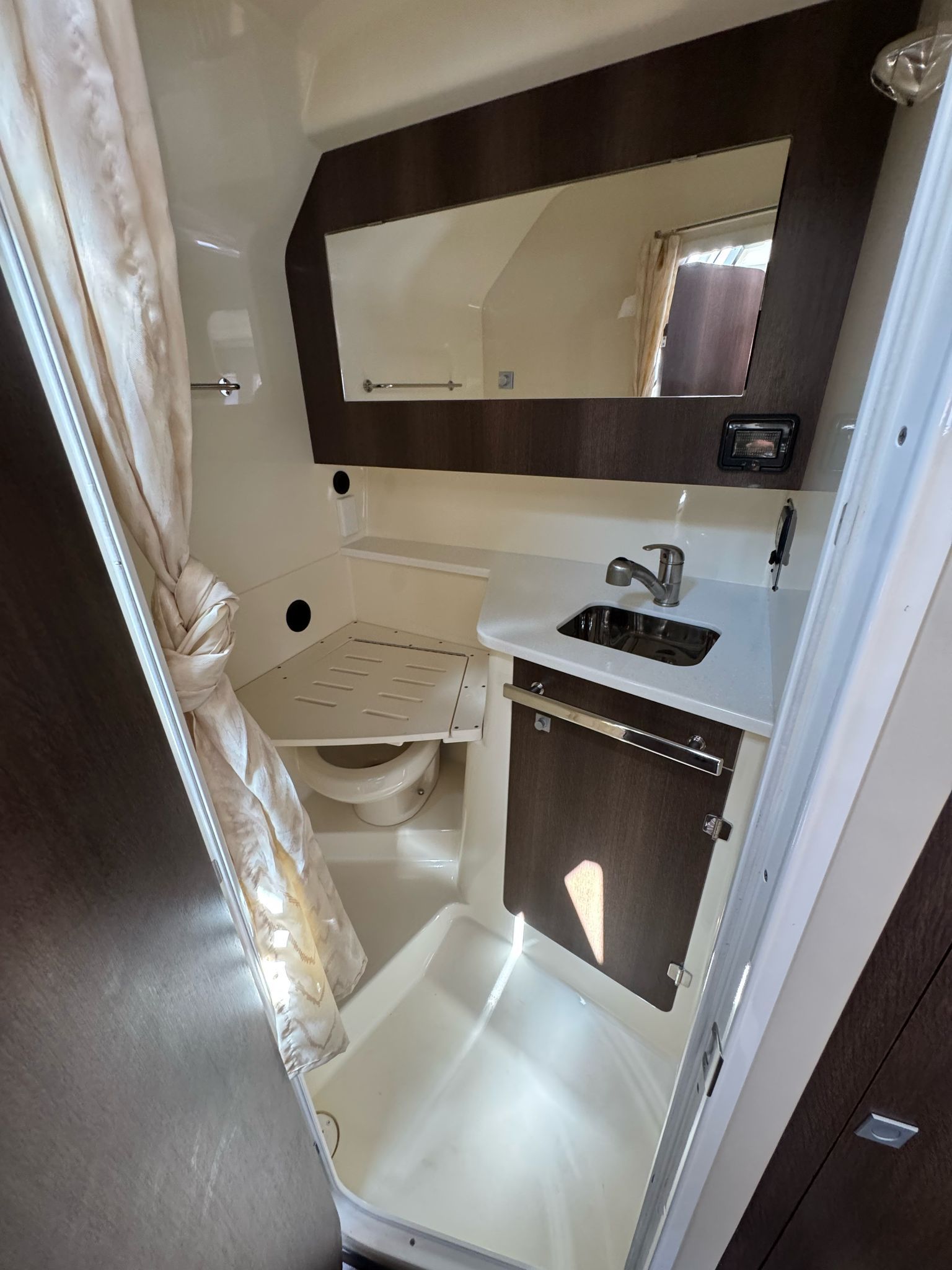 Interior of 2015 Monterey 360 Sport Coupe featuring bathroom and sink.