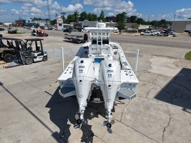 Tidewater 3100 Carolina Bay 2026 with twin 350 HP engines on a parking lot.