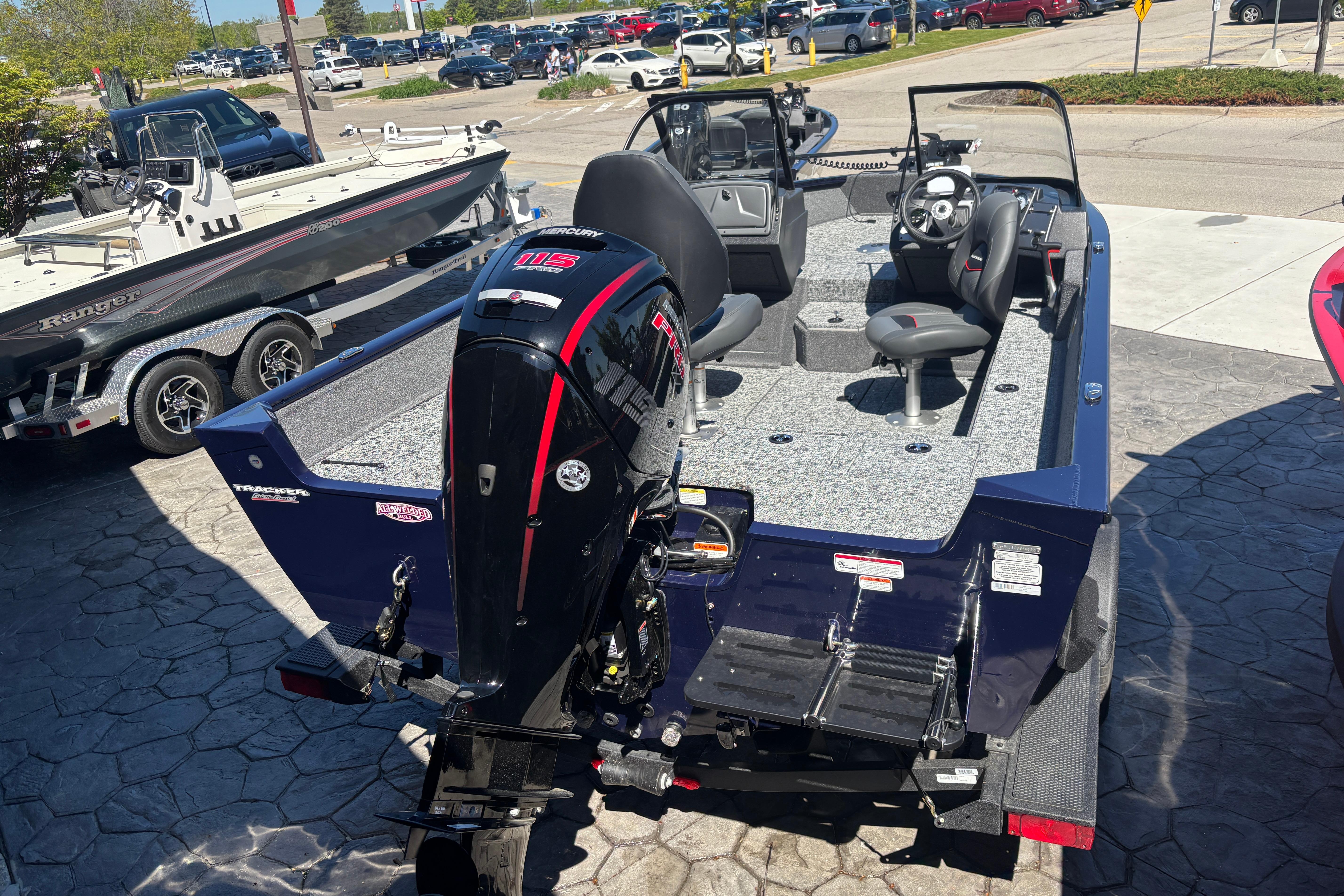 2026 Tracker Pro Guide V-175 WT boat with Mercury 115 outboard motor, parked outdoors.
