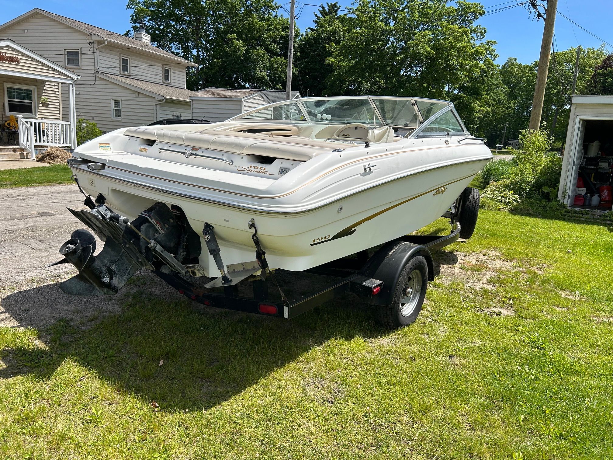1998 Sea Ray 190 Bow Rider on trailer outdoors.