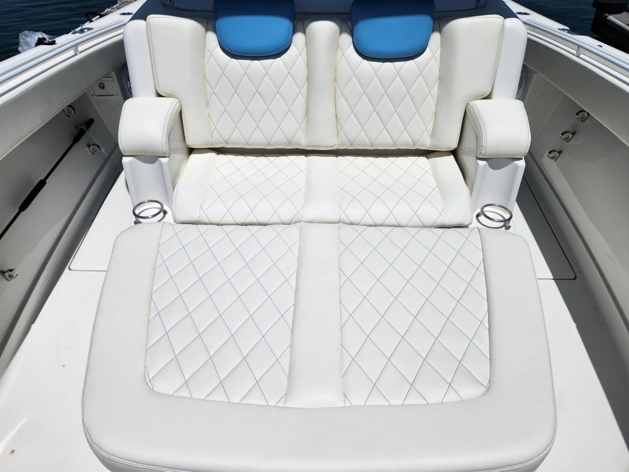 Luxurious white seating on 2018 HCB 39 Speciale boat with quilted design.