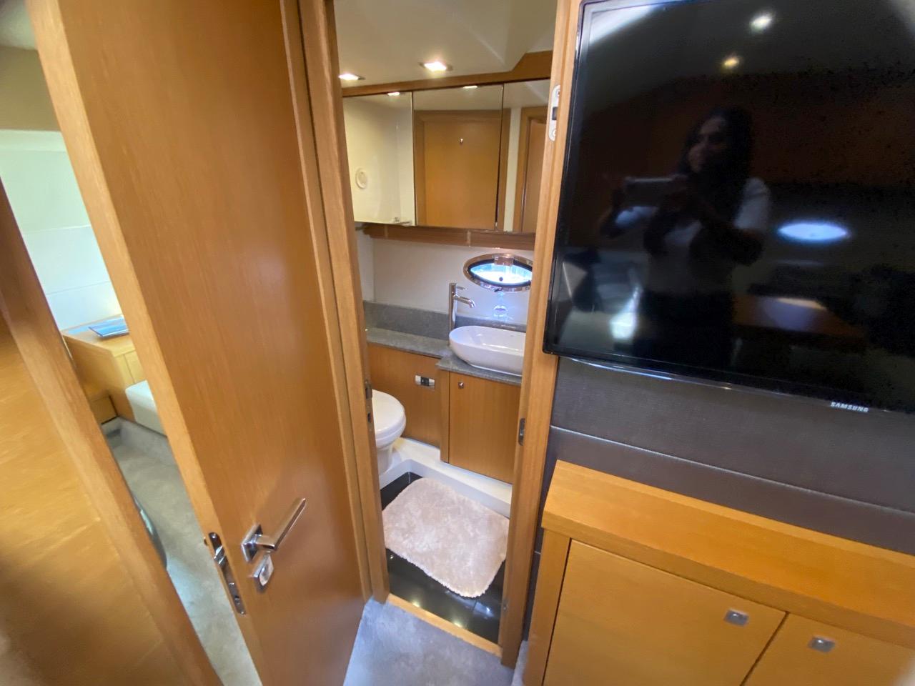 Interior of 2014 Sunseeker 48 Portofino XPS yacht, featuring bathroom and modern wood cabinetry.