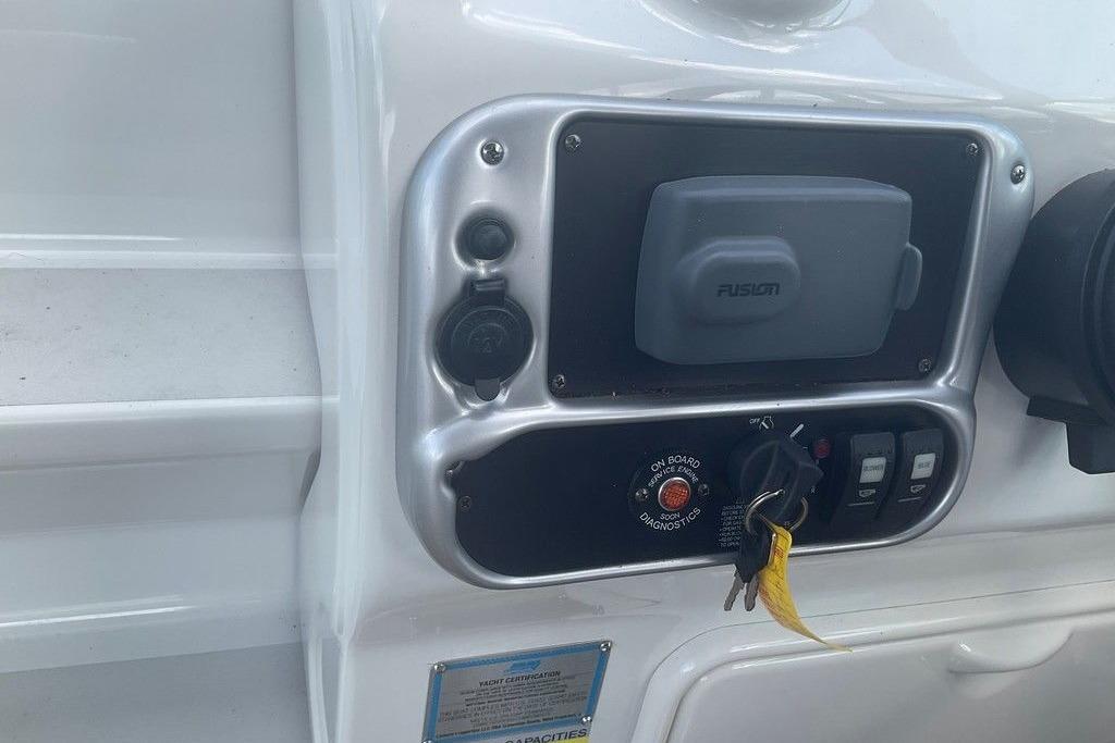 Control panel of a 2015 Crownline 236 SC boat with keys and switches.