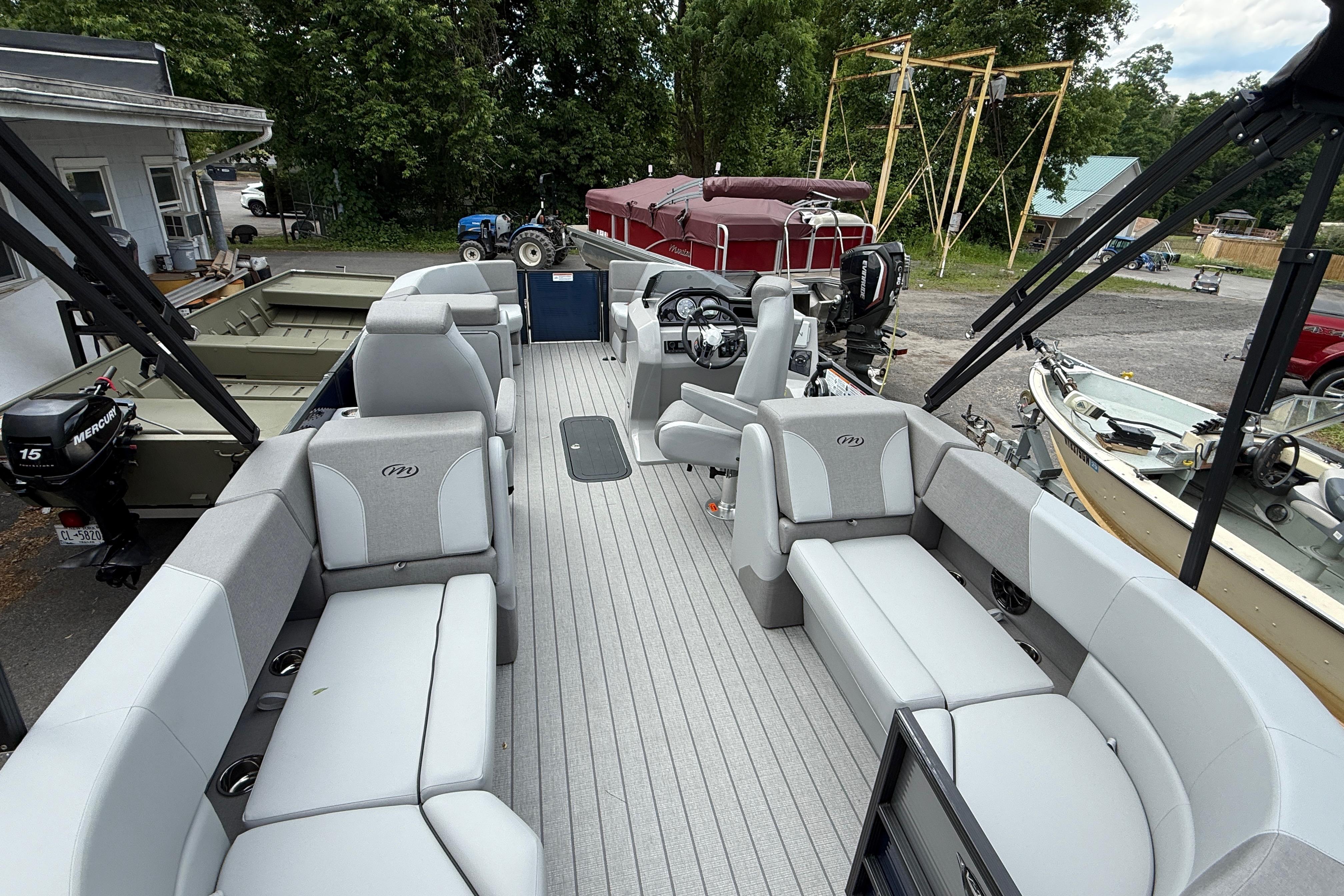 2027 Manitou Aurora RF 23 pontoon boat with spacious seating and modern design.