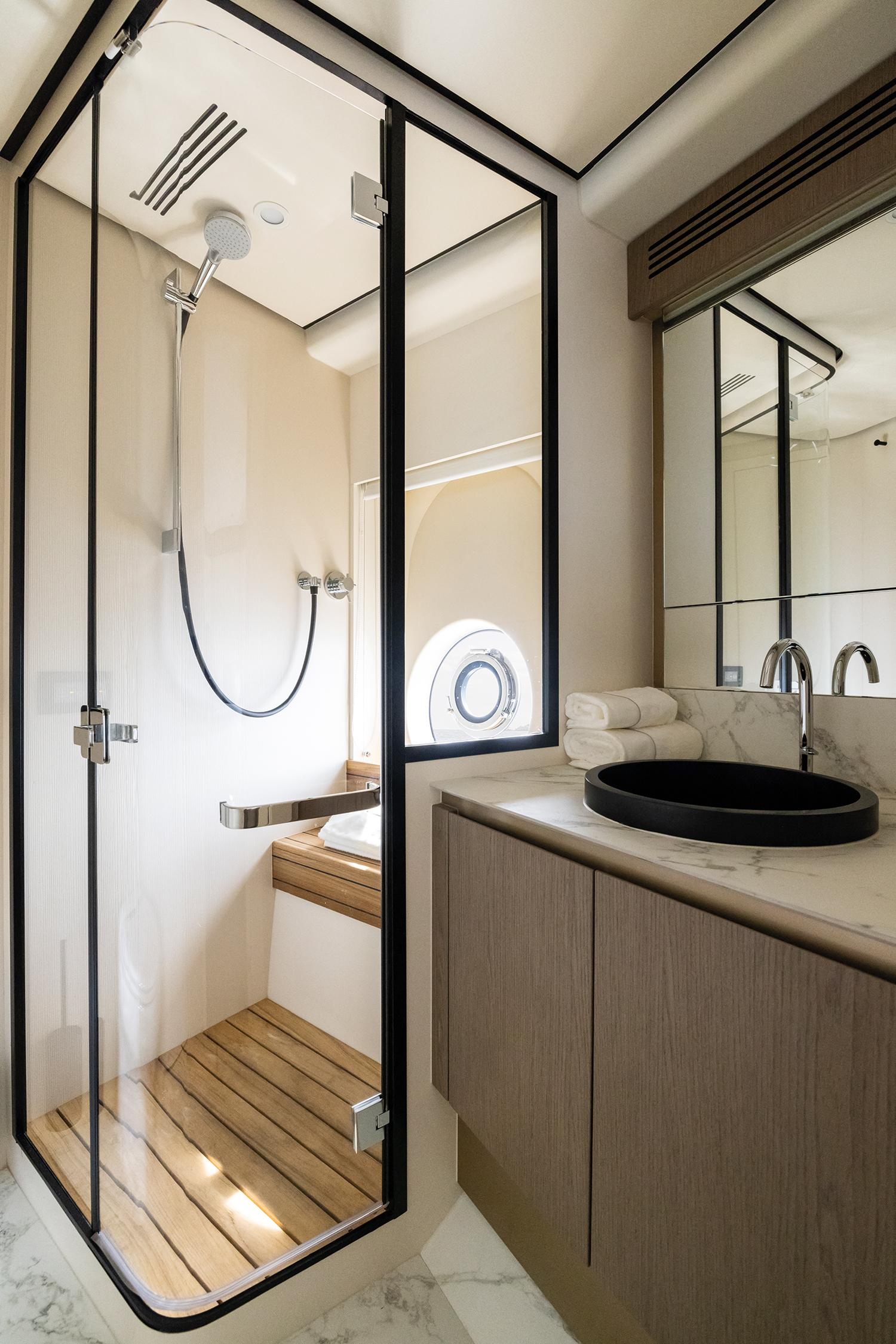 Luxurious bathroom in 2025 Azimut Magellano 60 yacht with modern shower and sleek design.