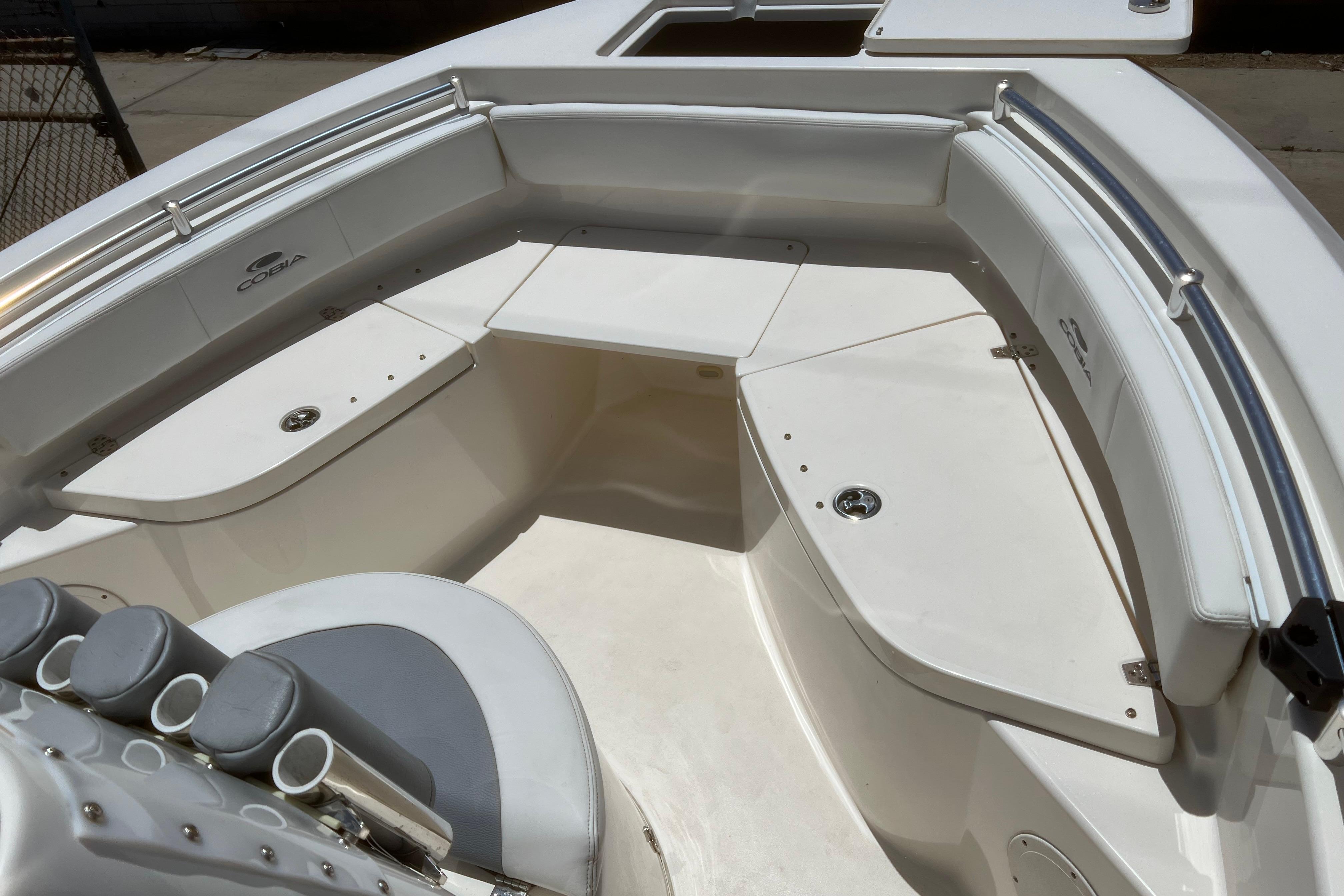 2018 Cobia 201 Center Console boat interior with seating and storage compartments.