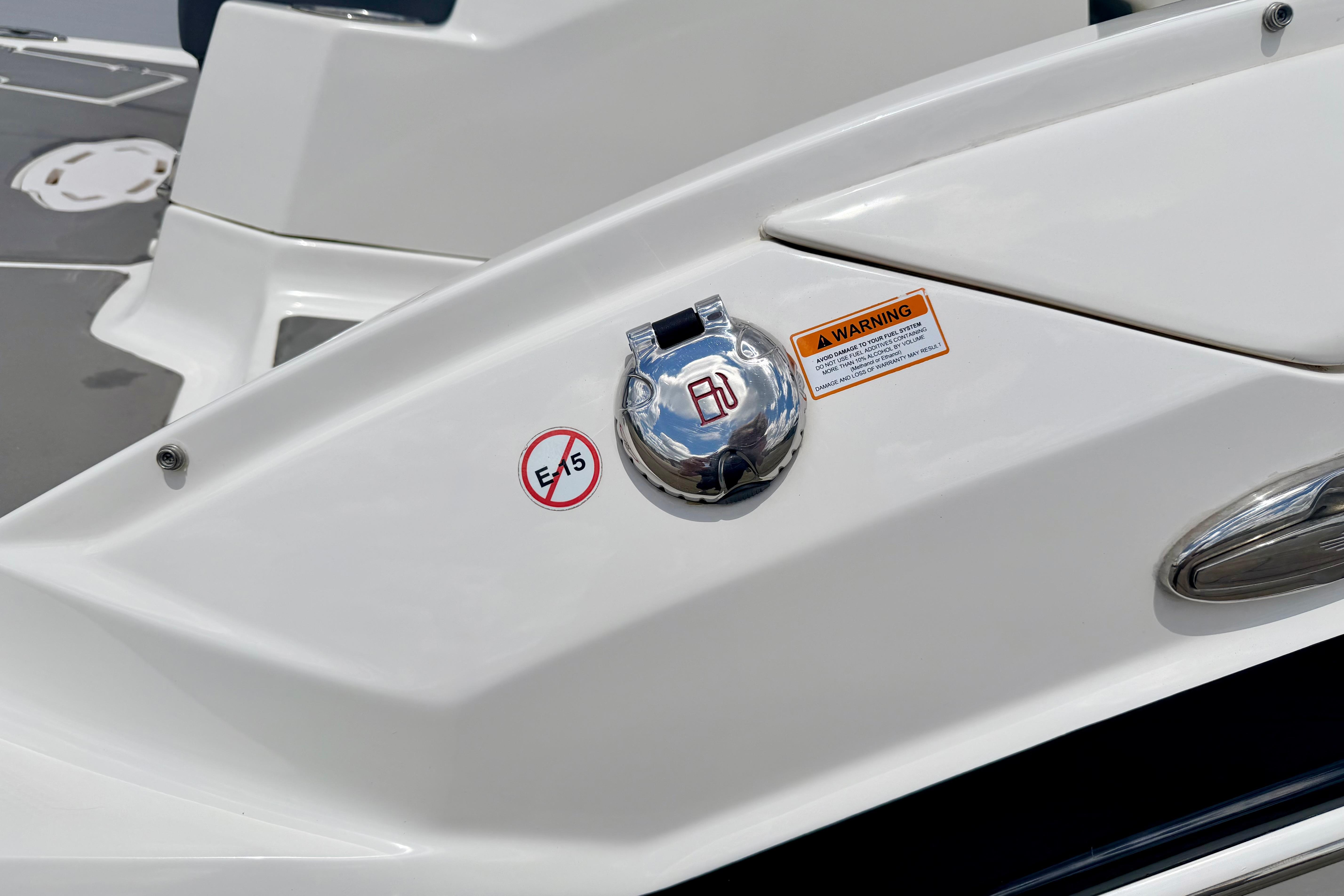 Fuel cap and warning label on 2015 Chaparral Sunesta 264 boat.