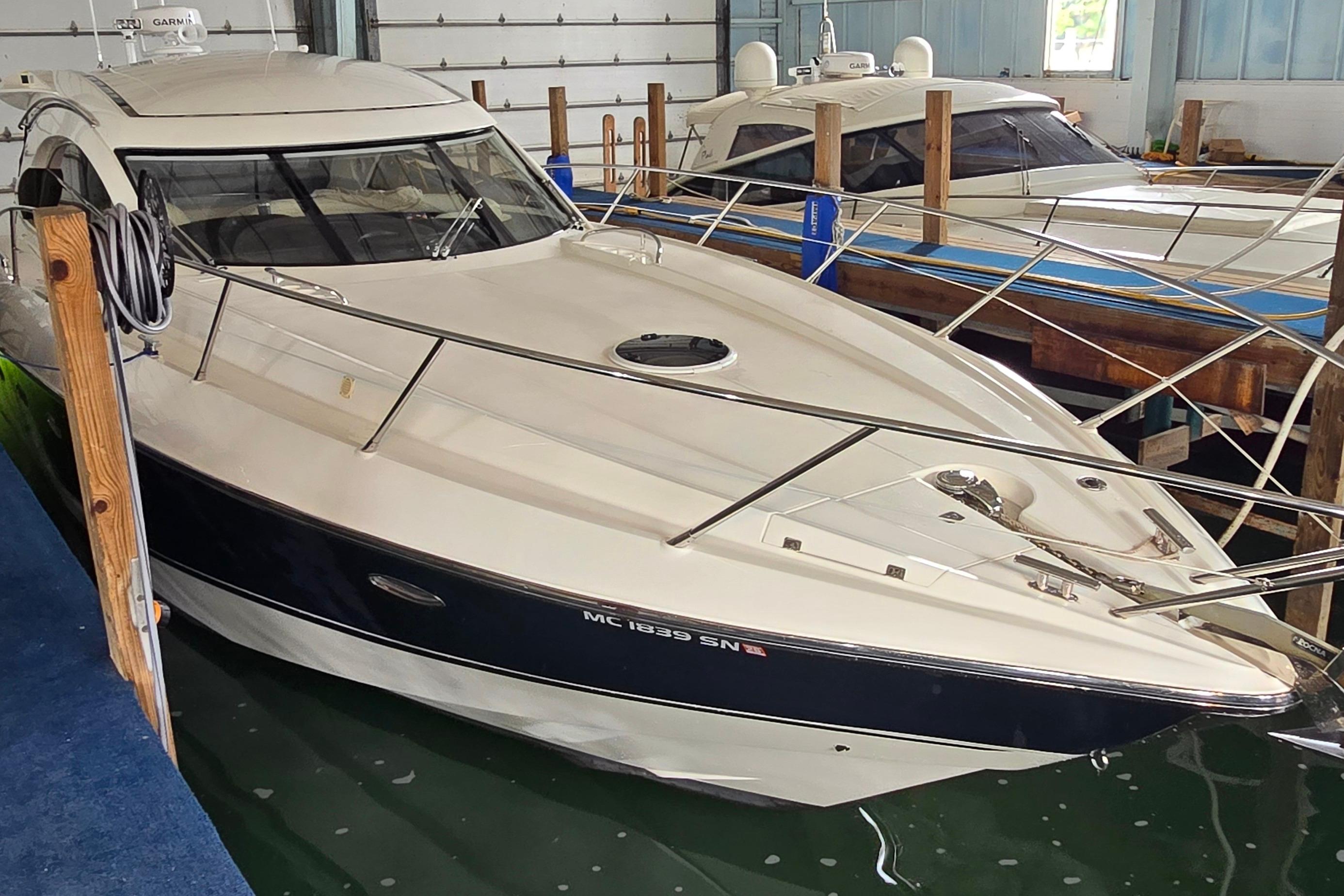 2004 Sunseeker Camargue 50 yacht docked indoors, showcasing sleek design and luxury features.