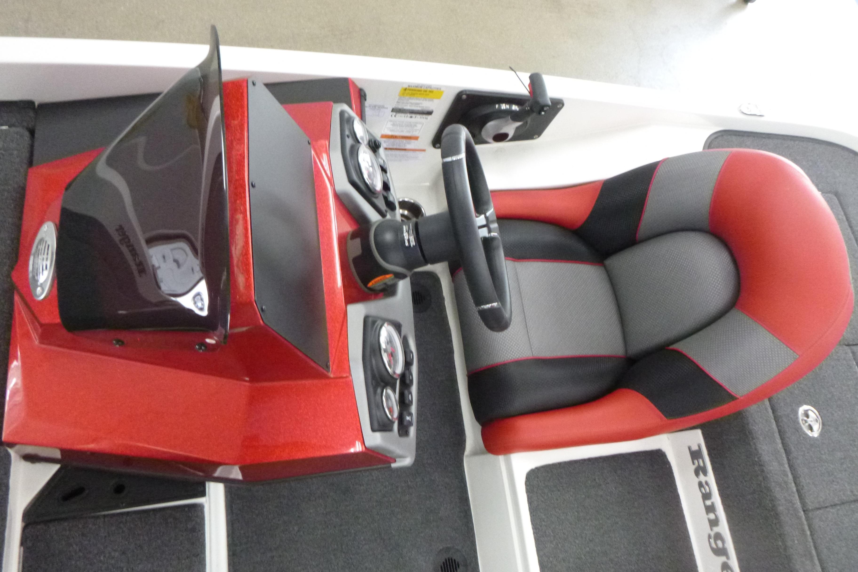 2025 Ranger Z185 boat cockpit with red and black seat, steering wheel, and dashboard controls.