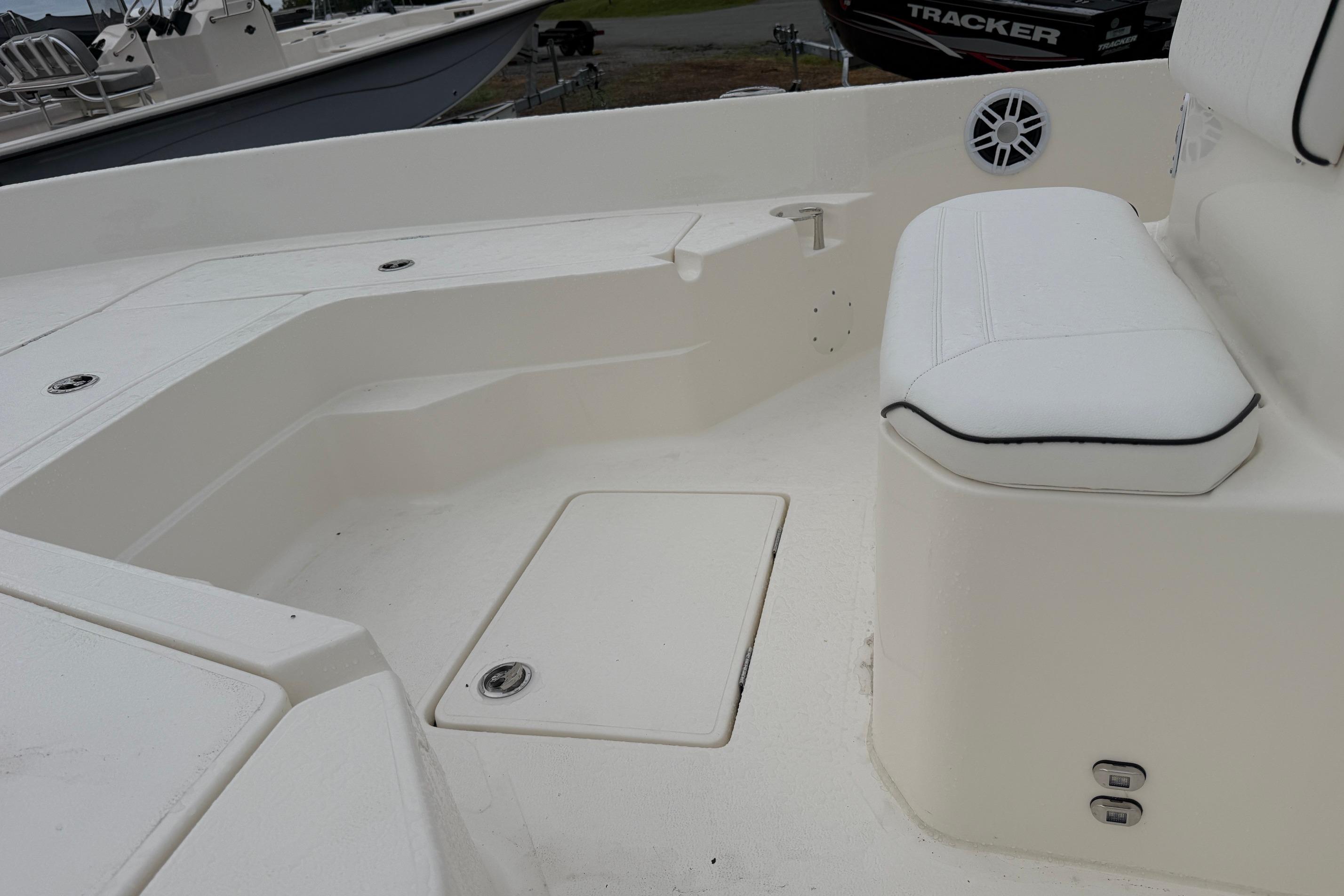 Interior of 2026 Skeeter SX2350 boat with white seating and storage compartments.